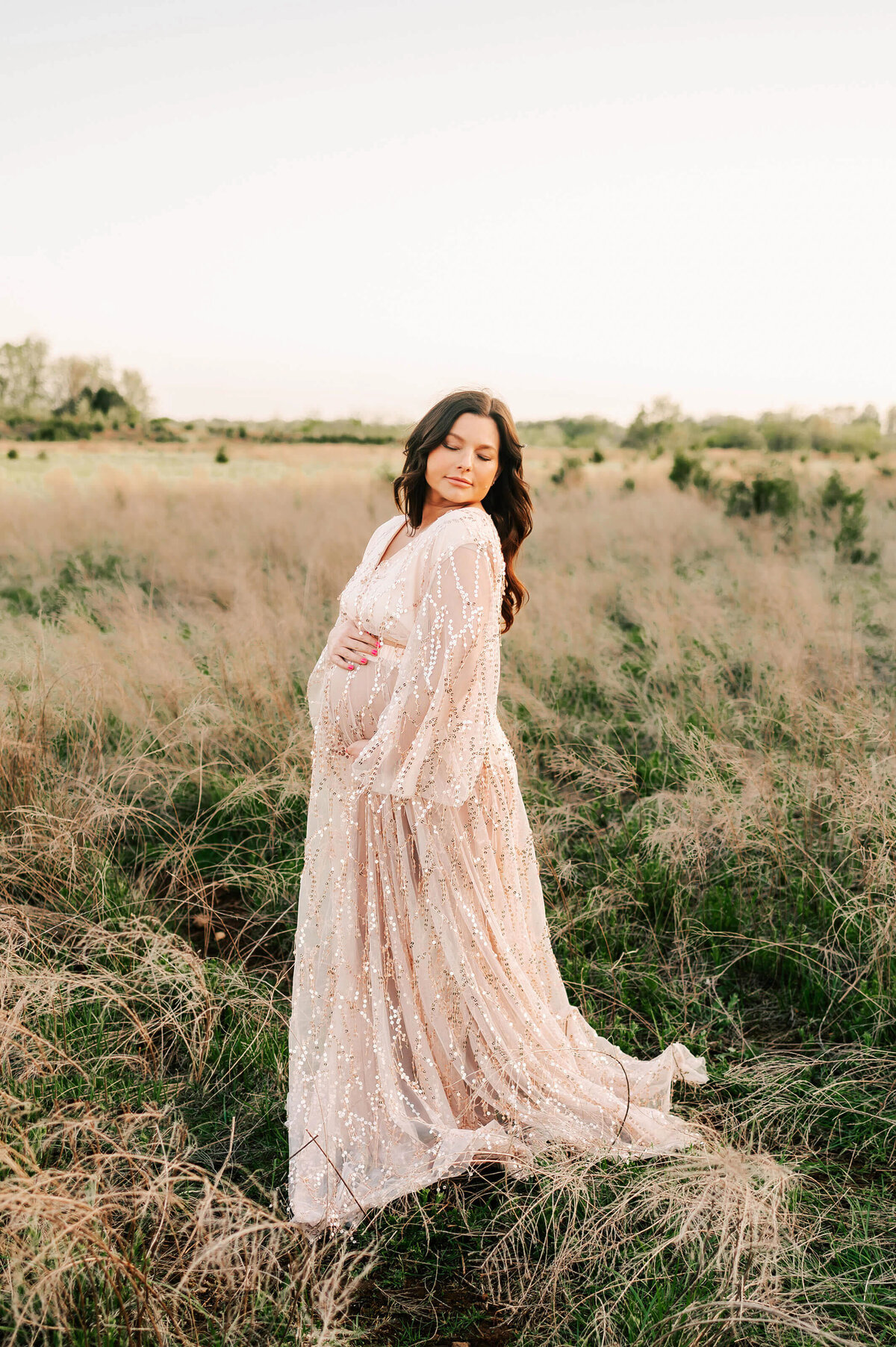 pregnant mom hugging baby bump during Joplin MO maternity photography session