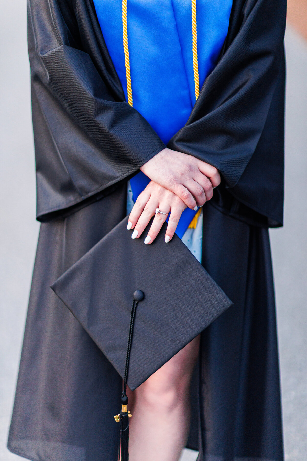 Close up of a girl holding a mortar board representing Boston senior pictures