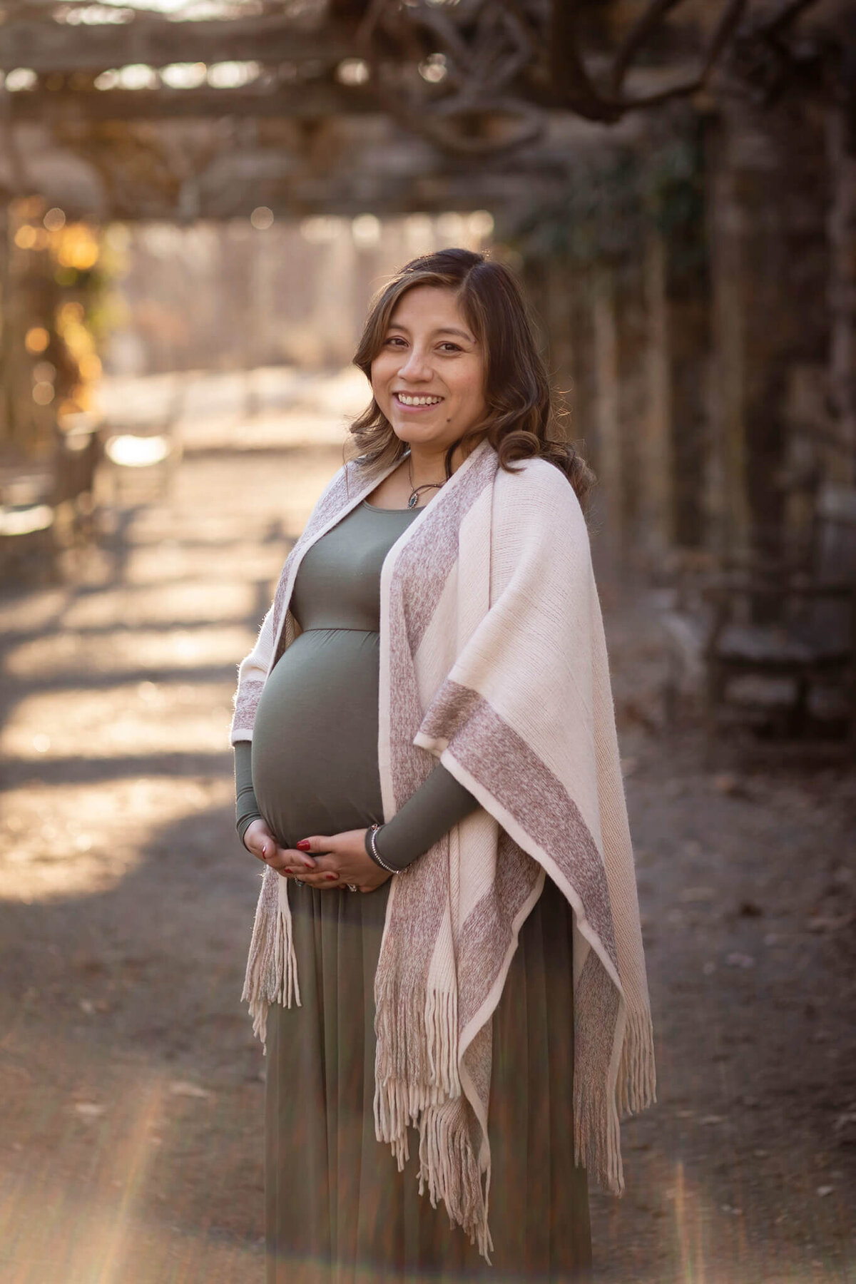 NJ maternity photography session set in a garden