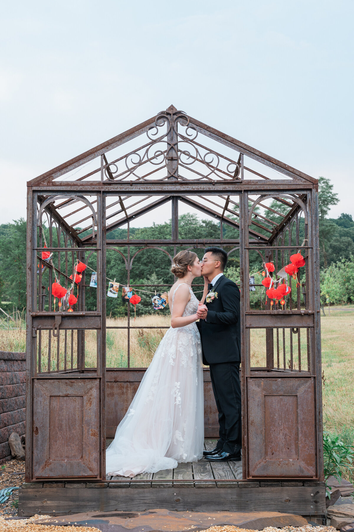 A couple kissing in a small gated awning