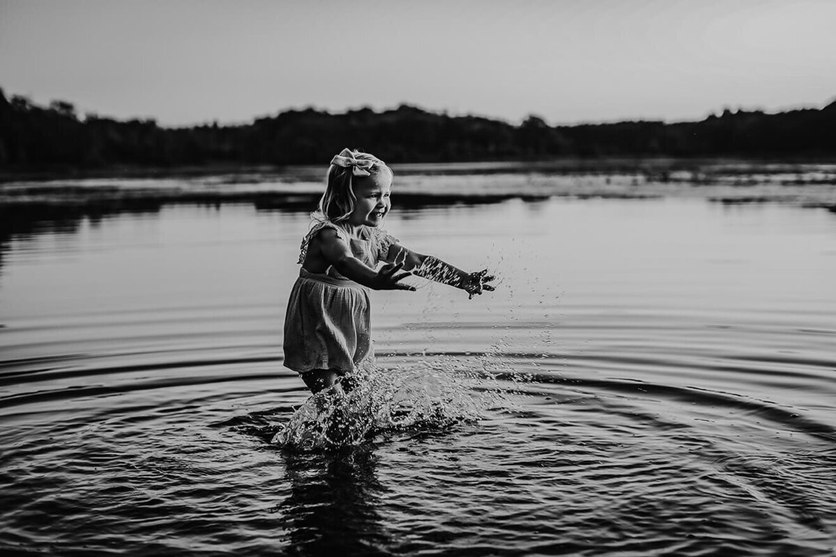 Little girl splashing in water