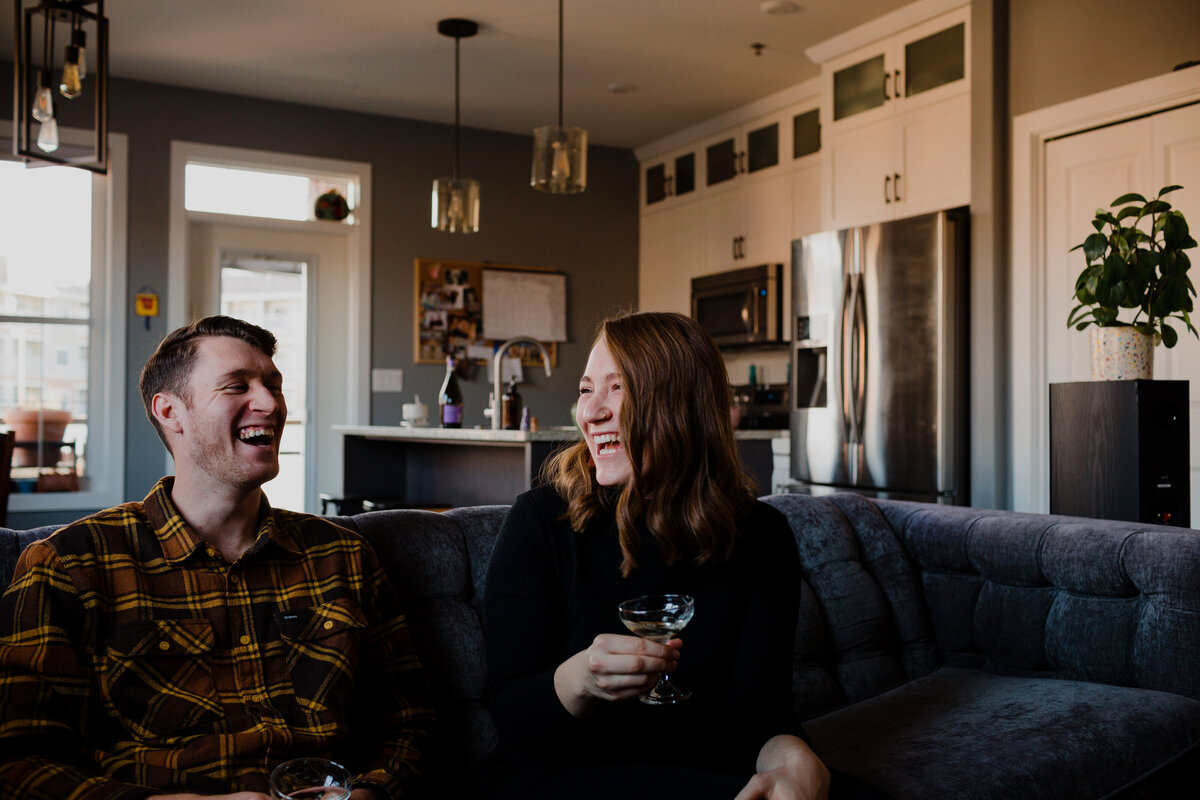 Couple drinking champagne on couch