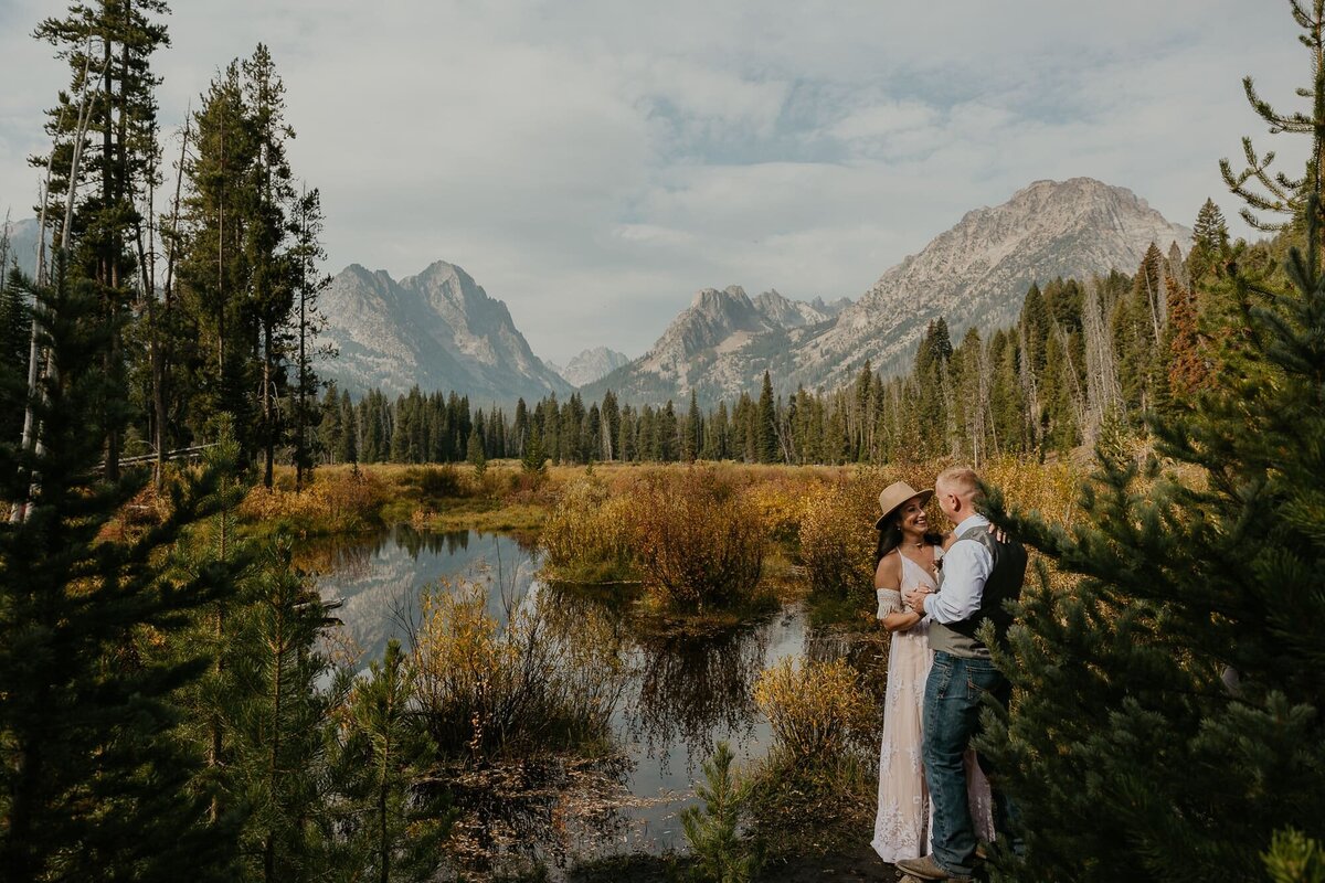 A couple having their first dance below the Sawtooth Mountains on Fishhook Creek Trail