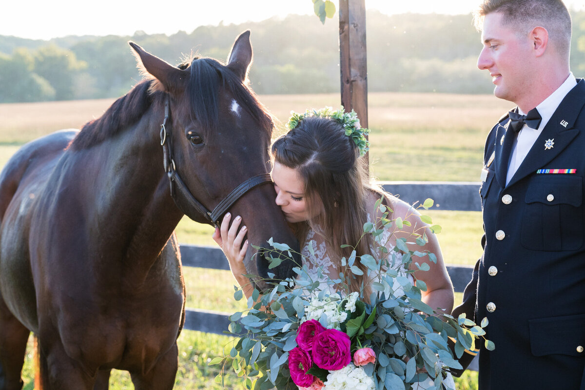 Bride and groom together with their horse at sunset in Berryville Virginia
