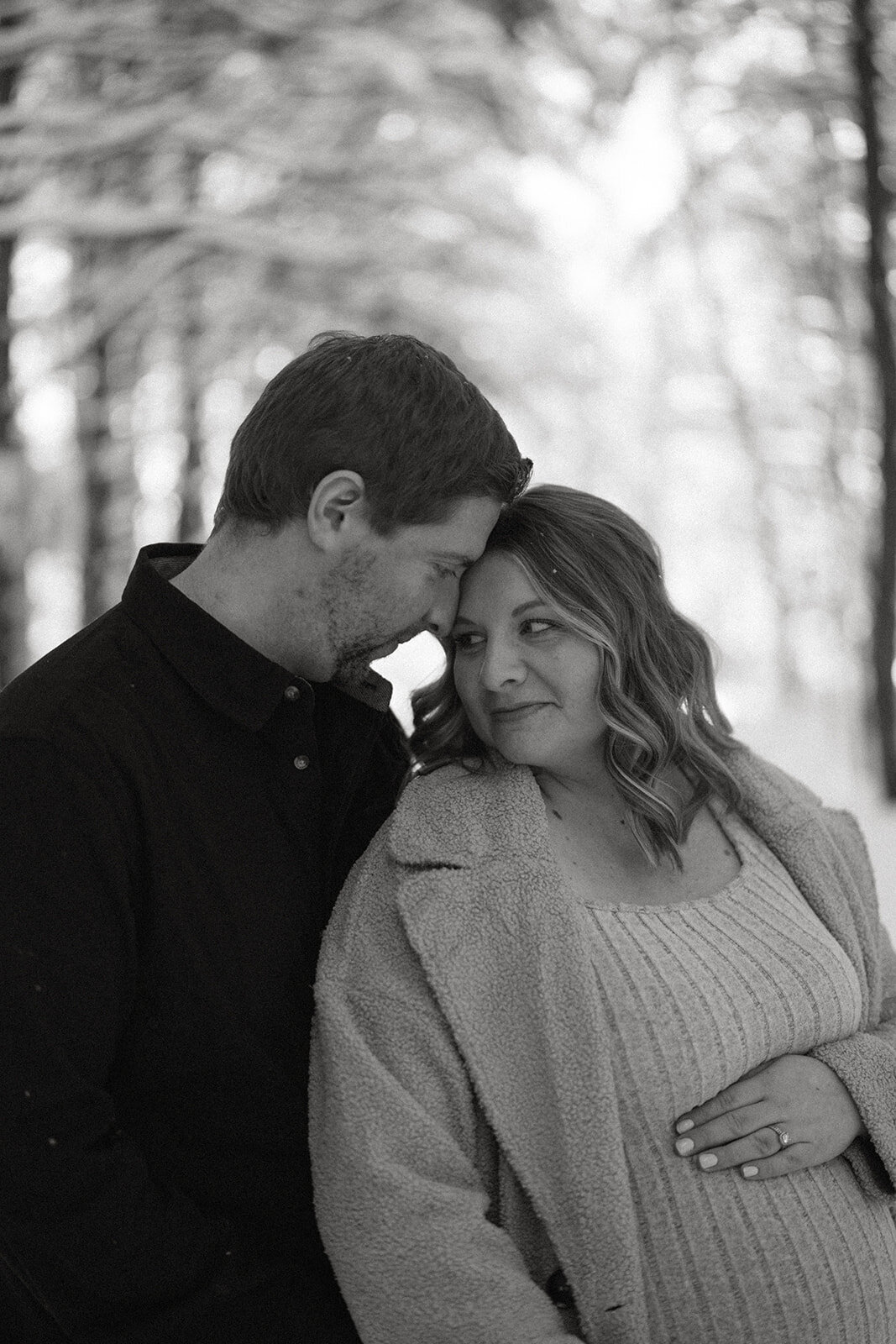 A photo of a mom and dad at Al Sabo Land preserve during their winter maternity session 
