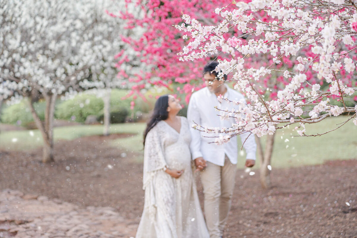 Cherish the anticipation of a baby's arrival in beautiful maternity photos at Gold Coast flower garden.