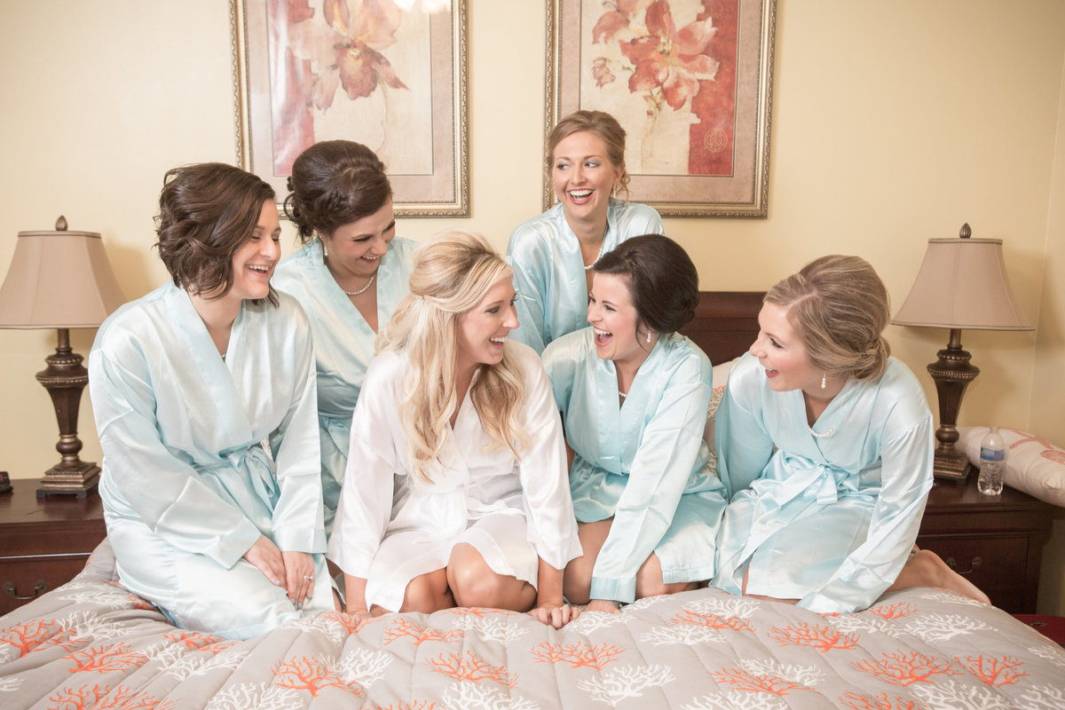 The bridal party having fun before getting dressed for the big day in Orange Beach, Alabama.