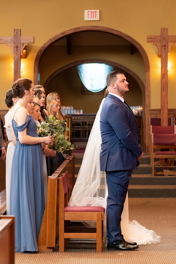 NFL free agent Groom and his Bride stand during their wedding ceremony at St. Bonaventure Church in Pittsburgh, PA