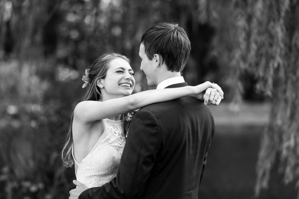 Ohio bride and groom lovingly share an intimate moment and dance with one another on their wedding day. Wedding reception at Meadow Ridge Events. Photographed by Aaron Aldhizer