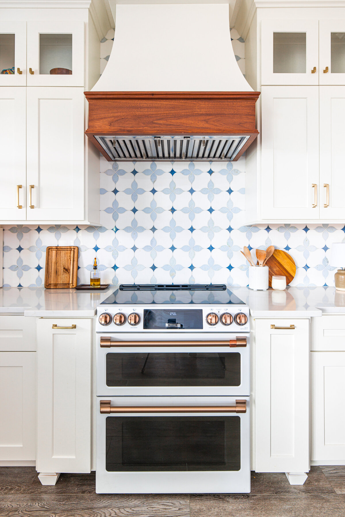 Park & Patina renovated this kitchen featuring custom cabinetry and morningstar marble backsplash