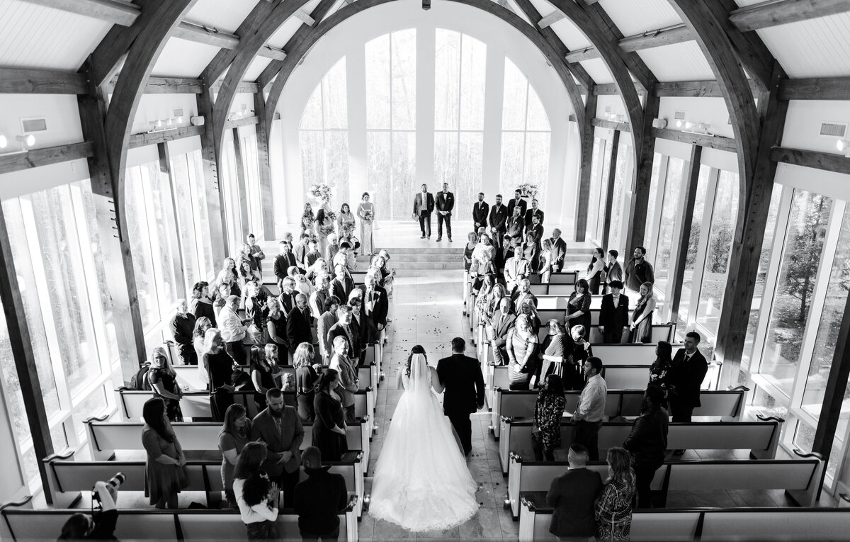 Epic overhead shot of bride walking down aisle at Ashton Gardens Chapel