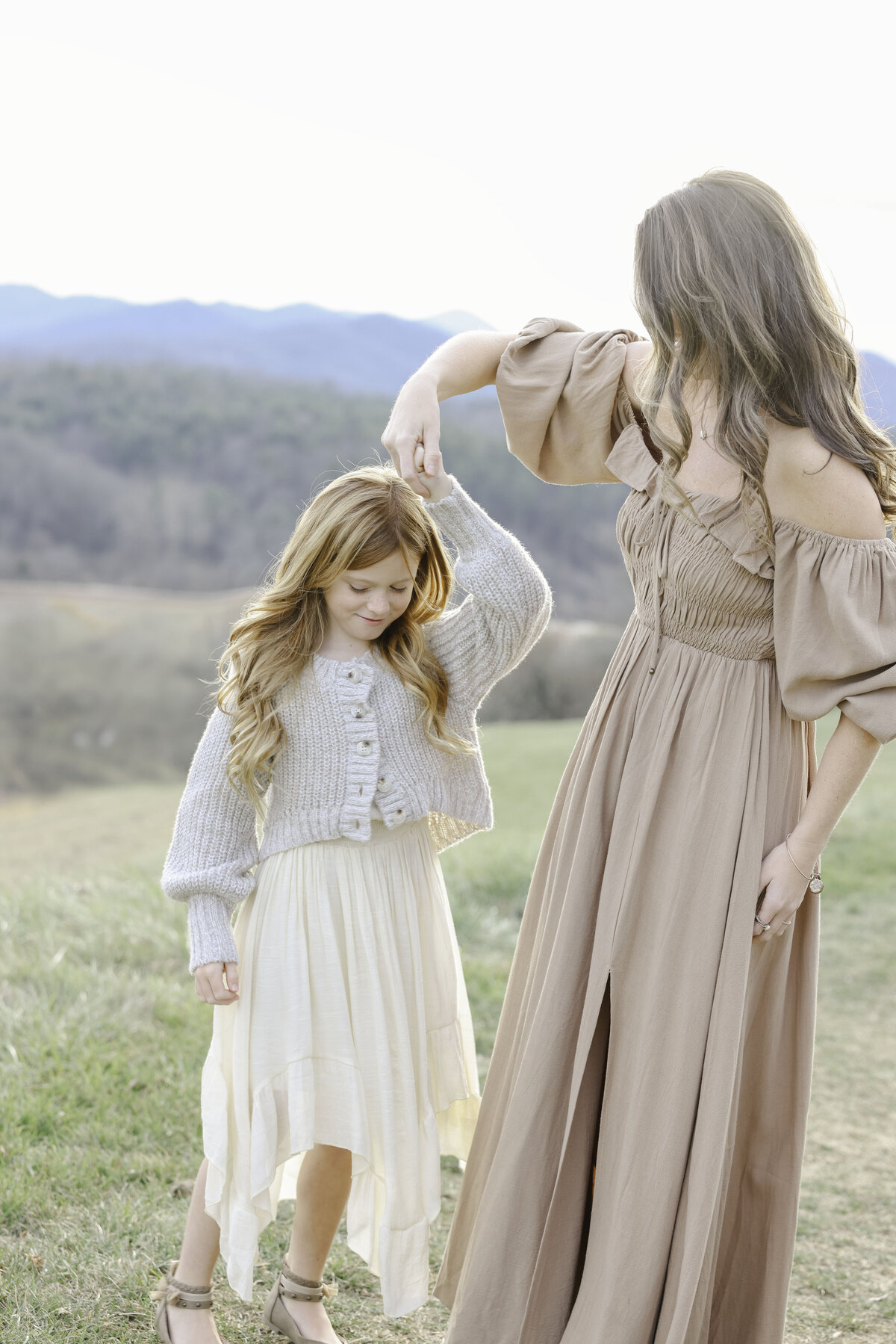 Mother spinning daughter at Asheville family photoshoot