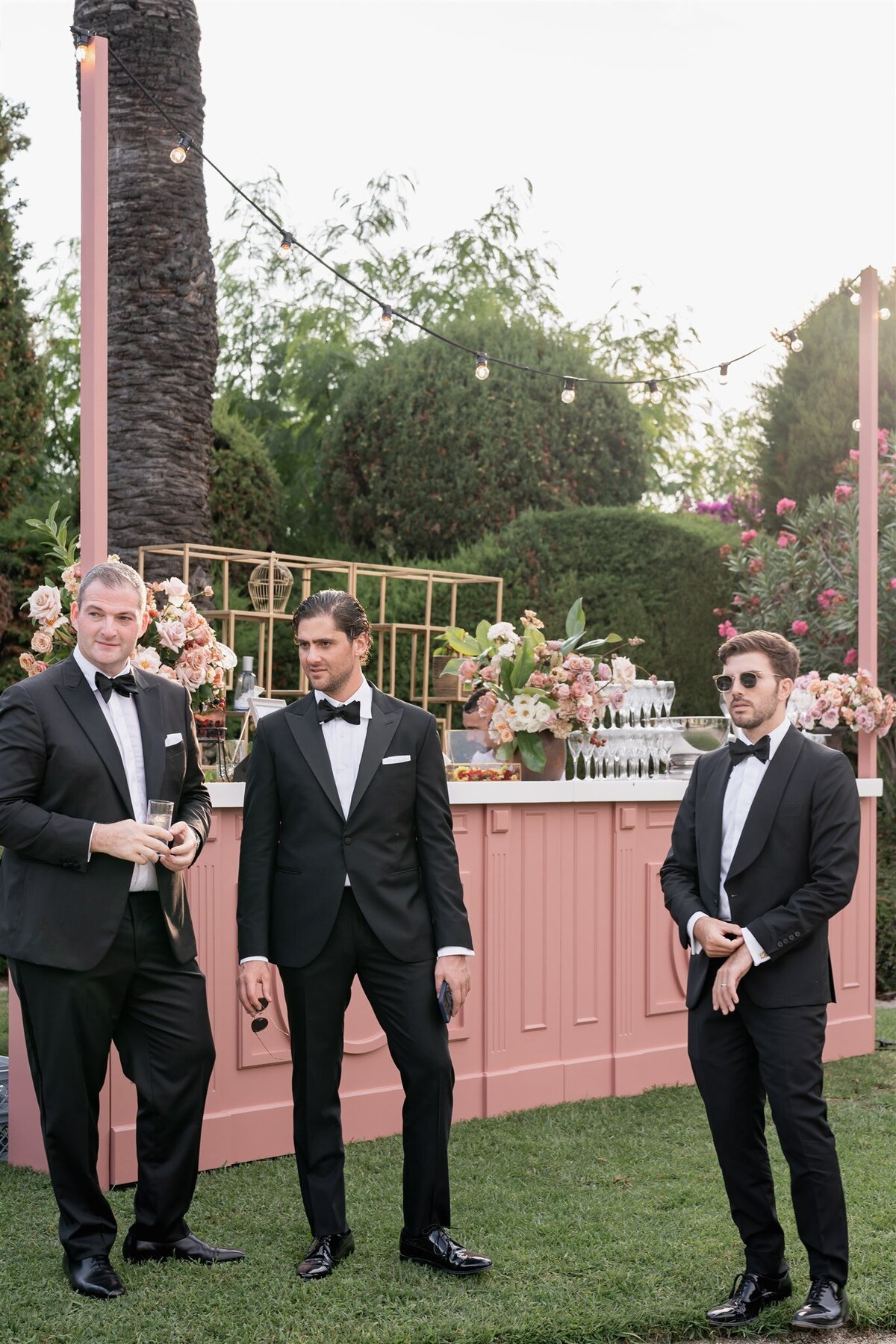 Groomsmen attending outdoor wedding ceremony Villa Ephrussi de Rotschild