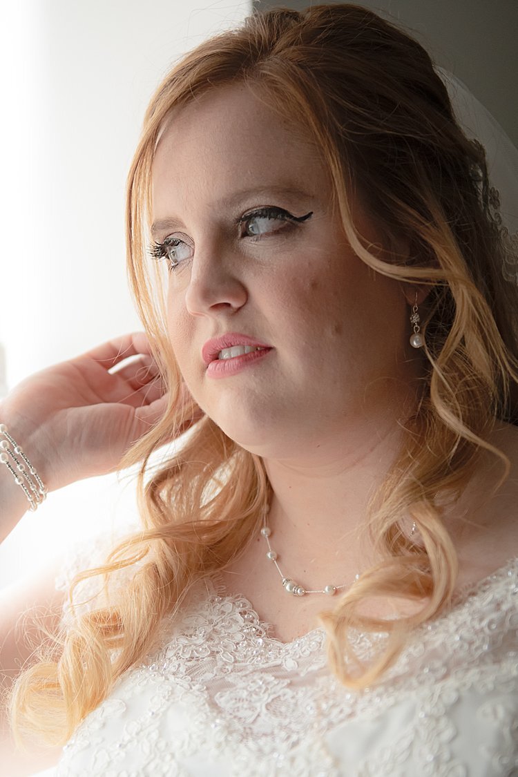 Close-up of Bride by window