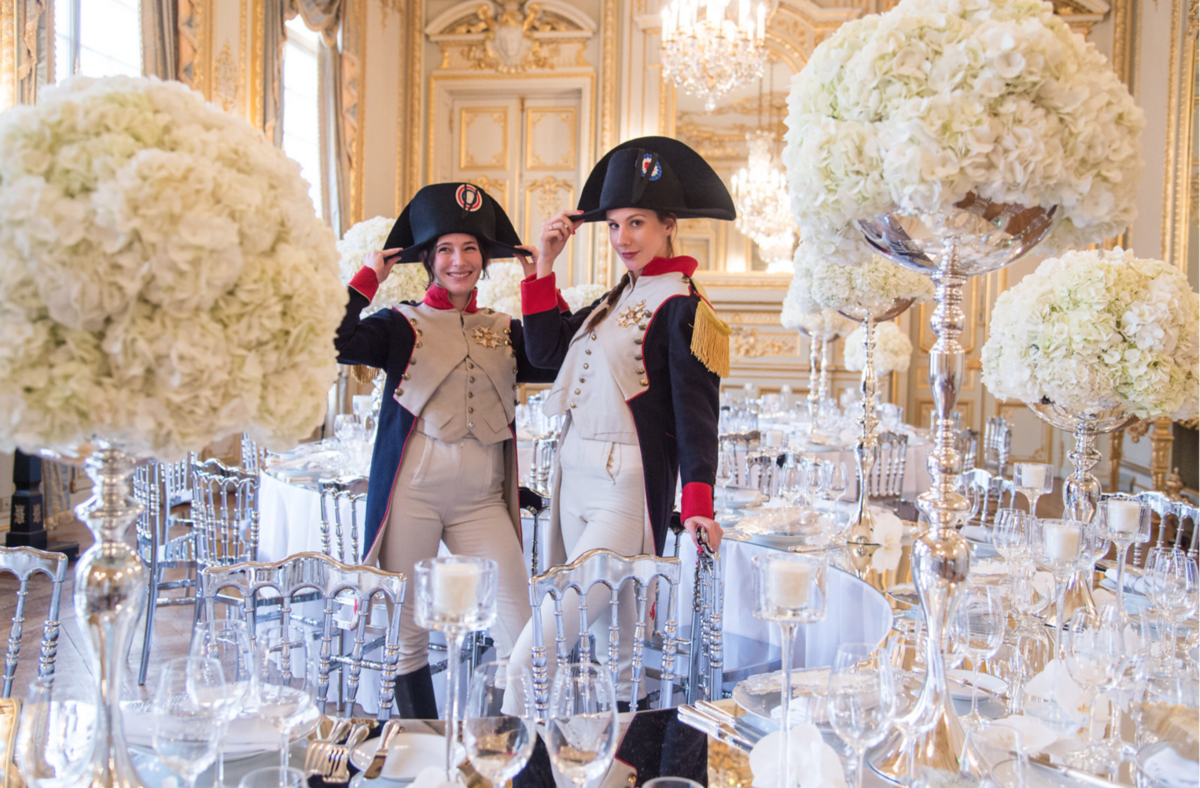 Men dressed as Napoleon at wedding reception