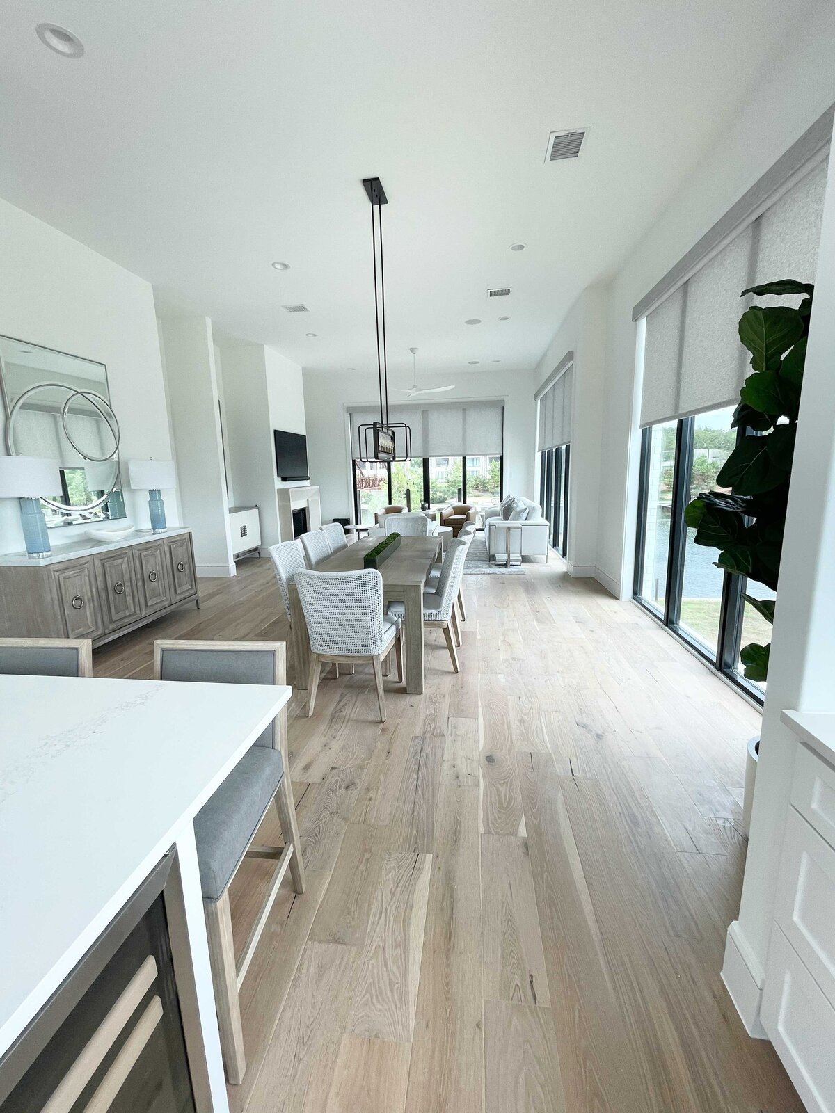 Interior design and construction for a house living room, featuring grey and white colors to create a peaceful and serene atmosphere with modern and elegant furnishings.
