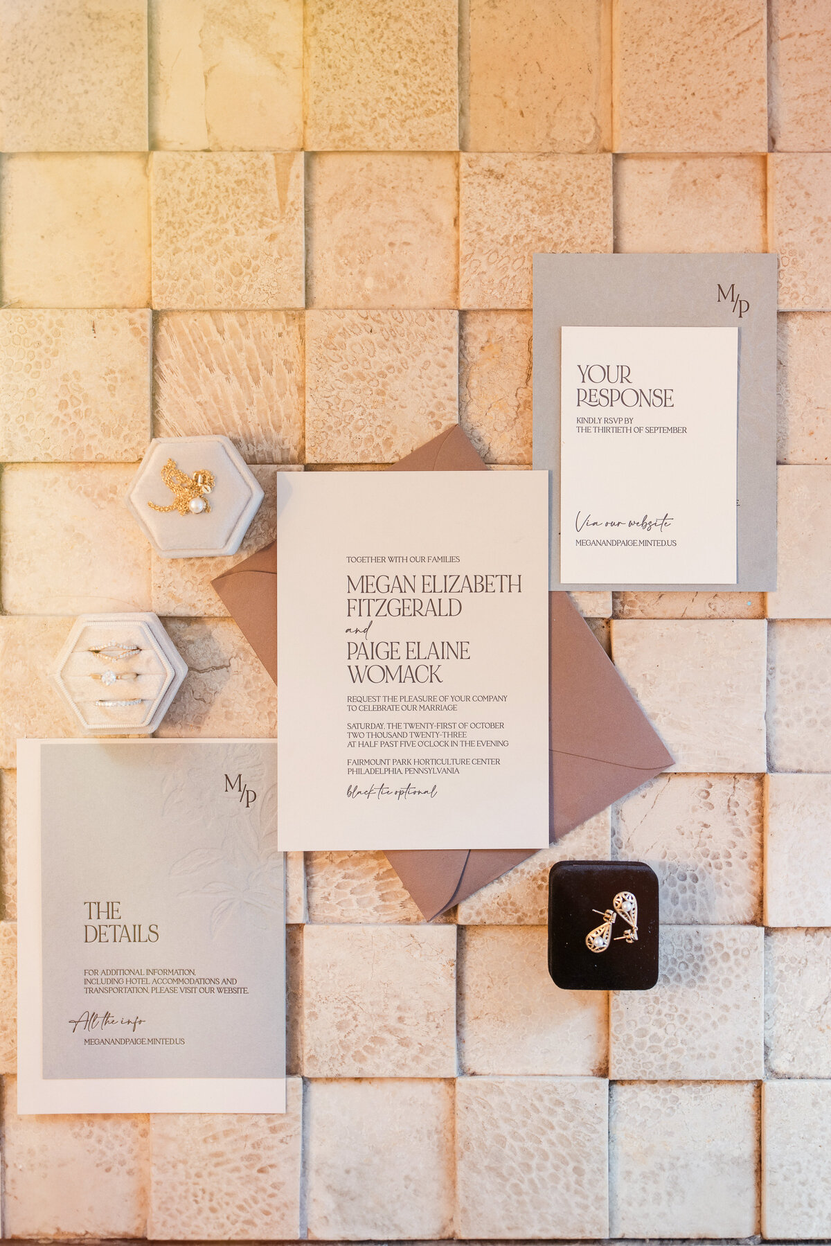 A flatlay of invitations at a  Fairmount Park Horticulture Center wedding