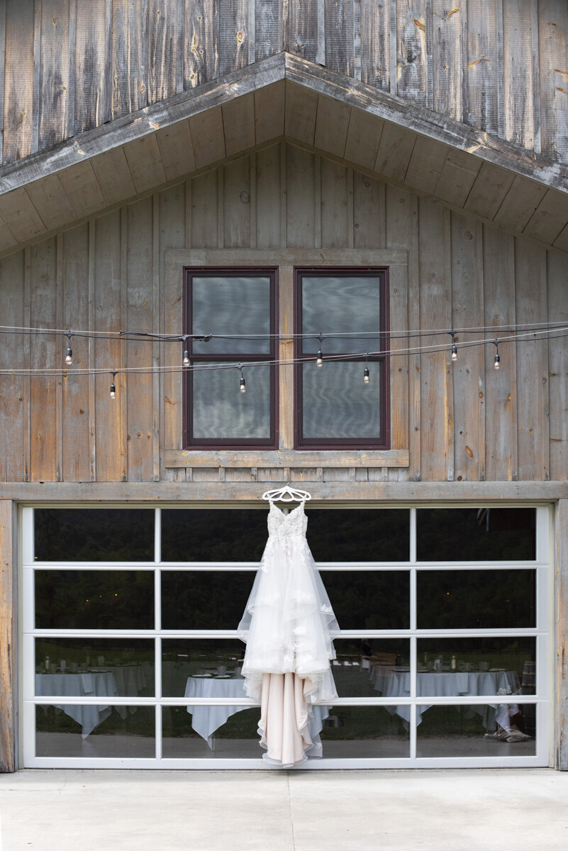 Bridal dress hanging at Claxton Farm wedding