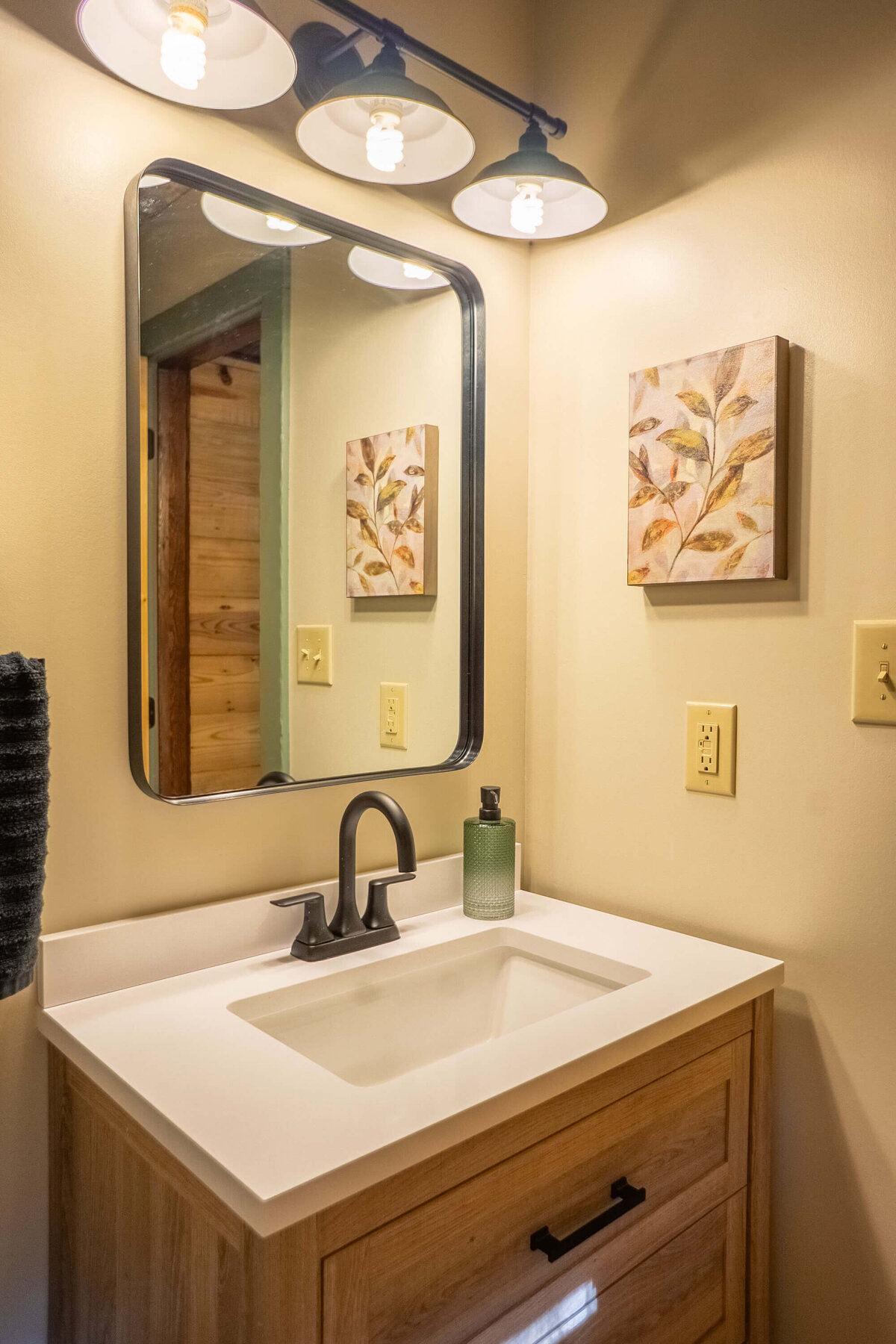 Clean cabin bathroom with fresh linens and space for storage