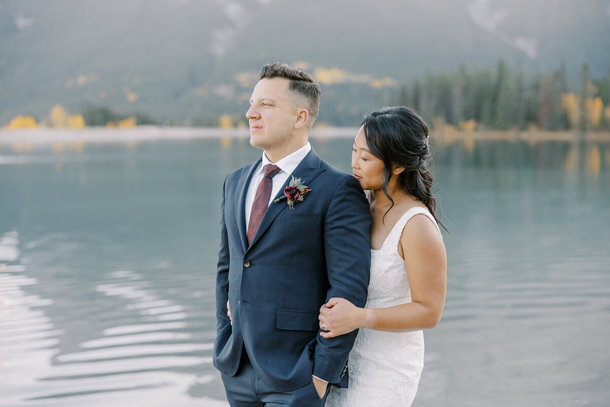 Bride and groom posing in Canmore
