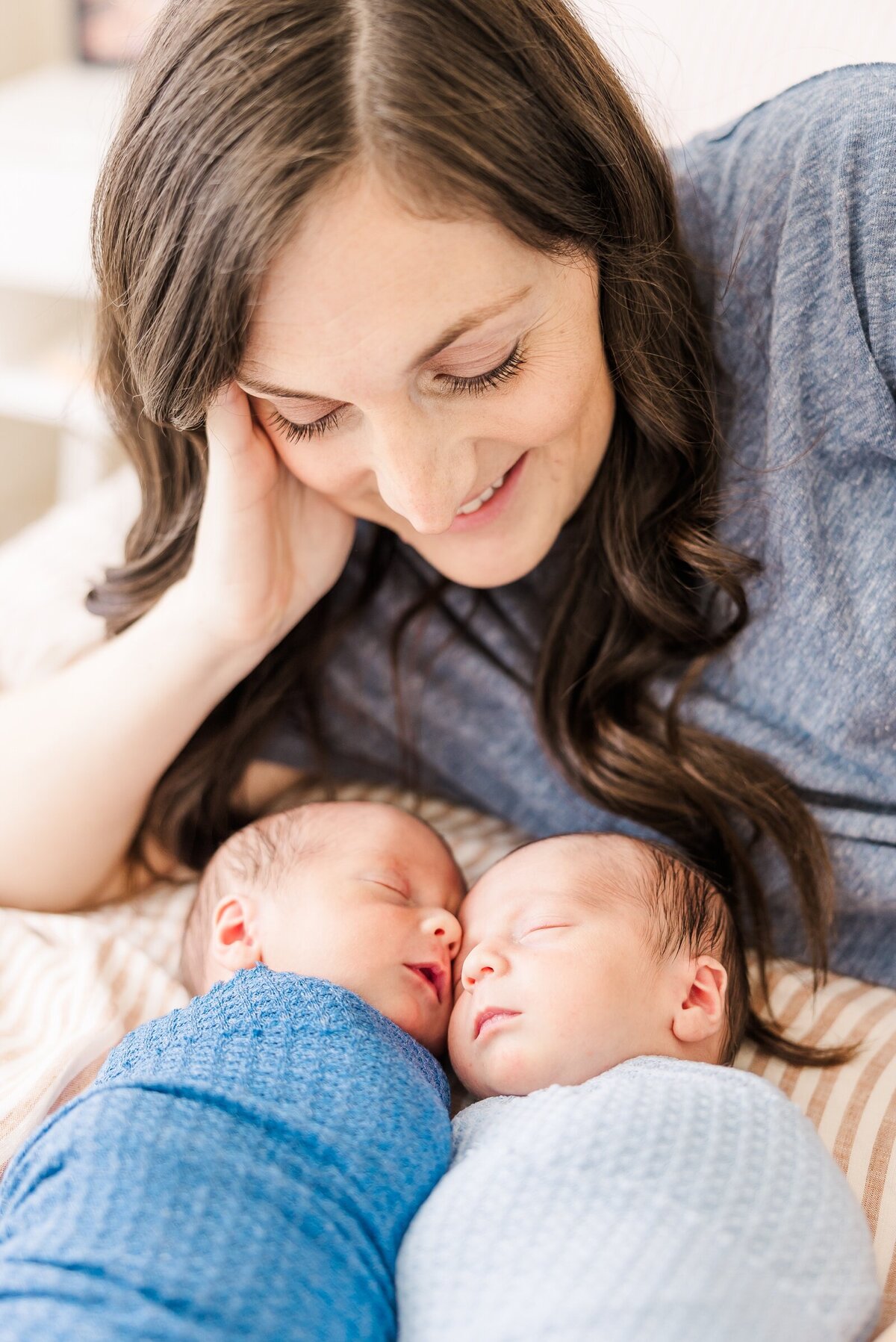 Mom smiling down towards her twin boys for Erin Thompson Photography