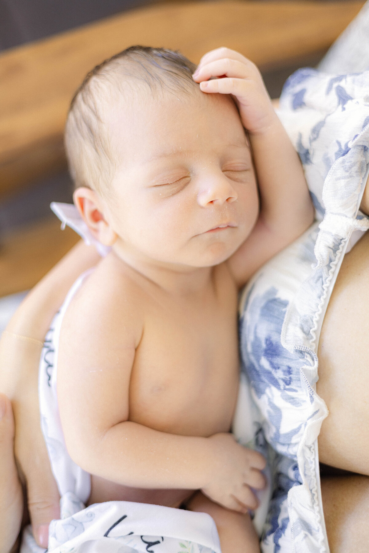Newborn swaddled in neutral blanket during lifestyle session in Cranford, NJ.