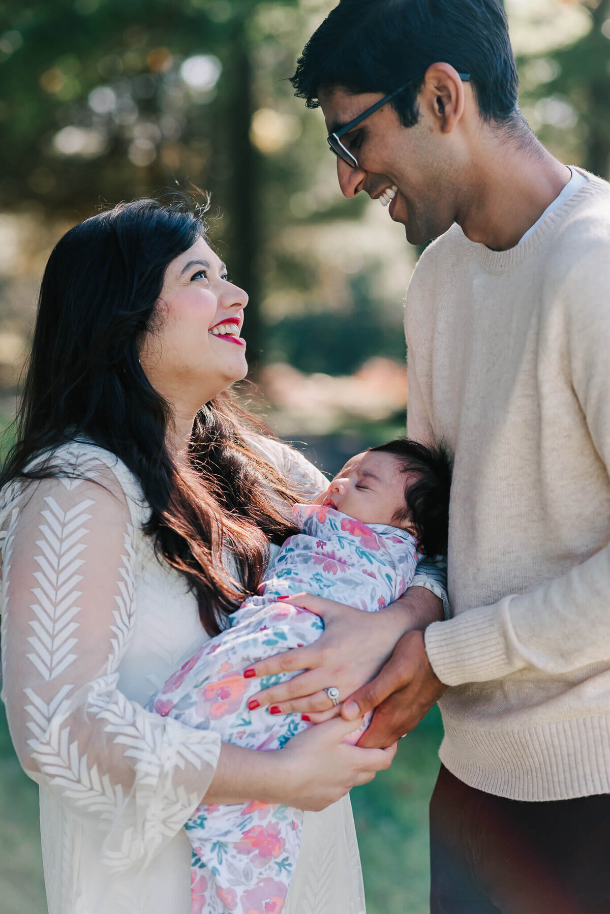 sweet moment of an indian family with their daughter, taken by a Northern VA newborn photographer