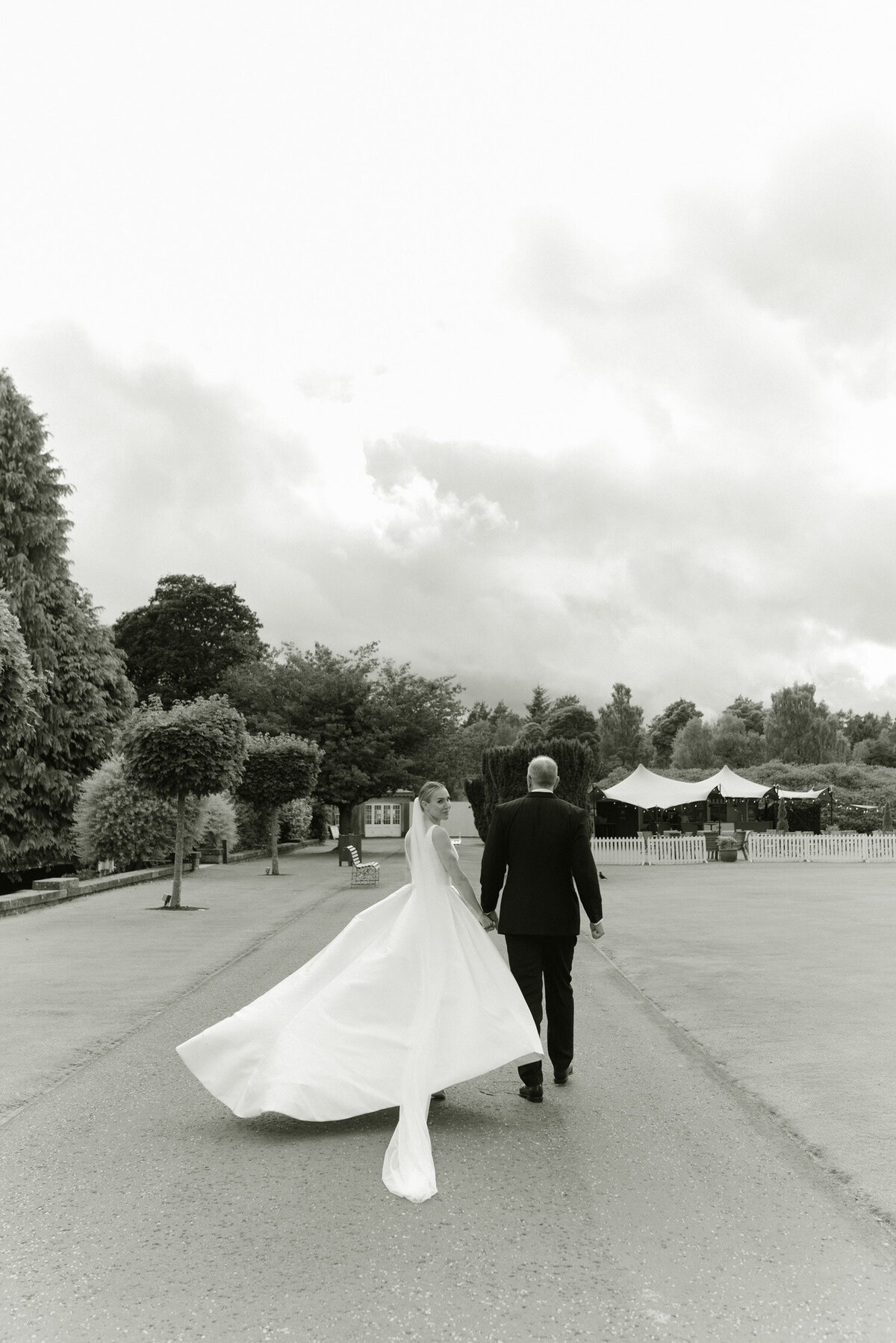 Editorial wedding photographer Scotland, Jill Cherry Porter, captures elegant Bride and Groom in the grounds of Gleneagles Hotel on their wedding day summer 2025.