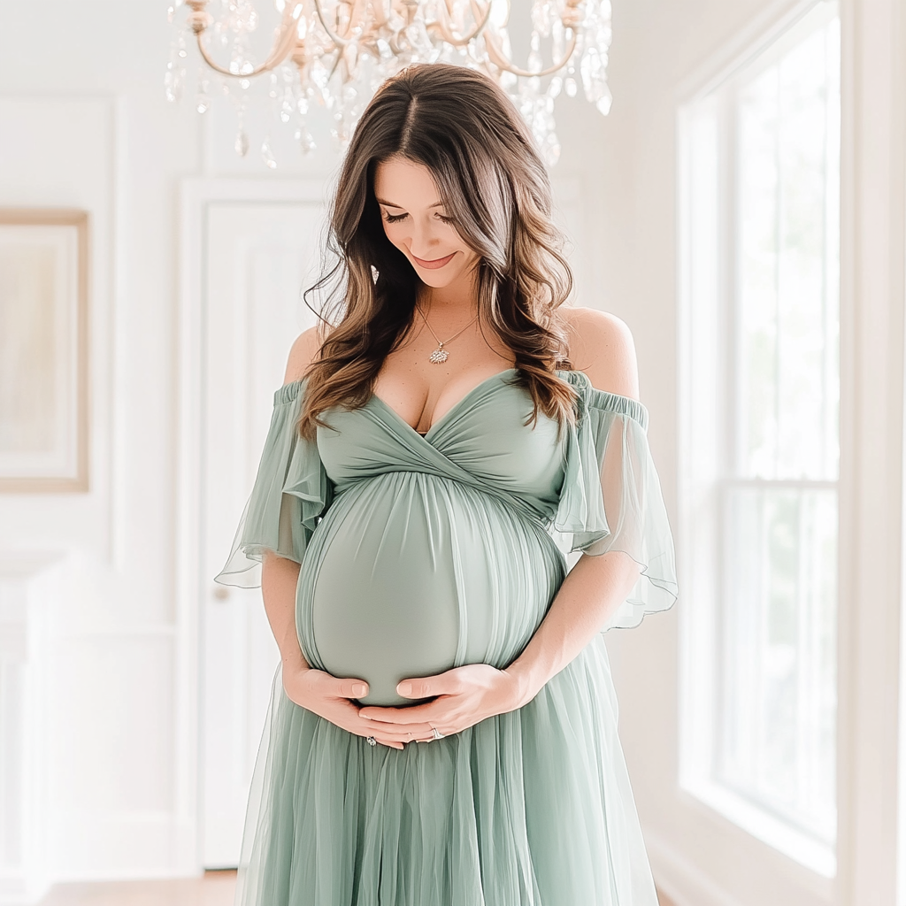kdurski_86694_a_pregnant_mom_holding_her_belly_wearing_a_sage_g_baaa9e32-934c-438c-9e47-bfcfca07ef92