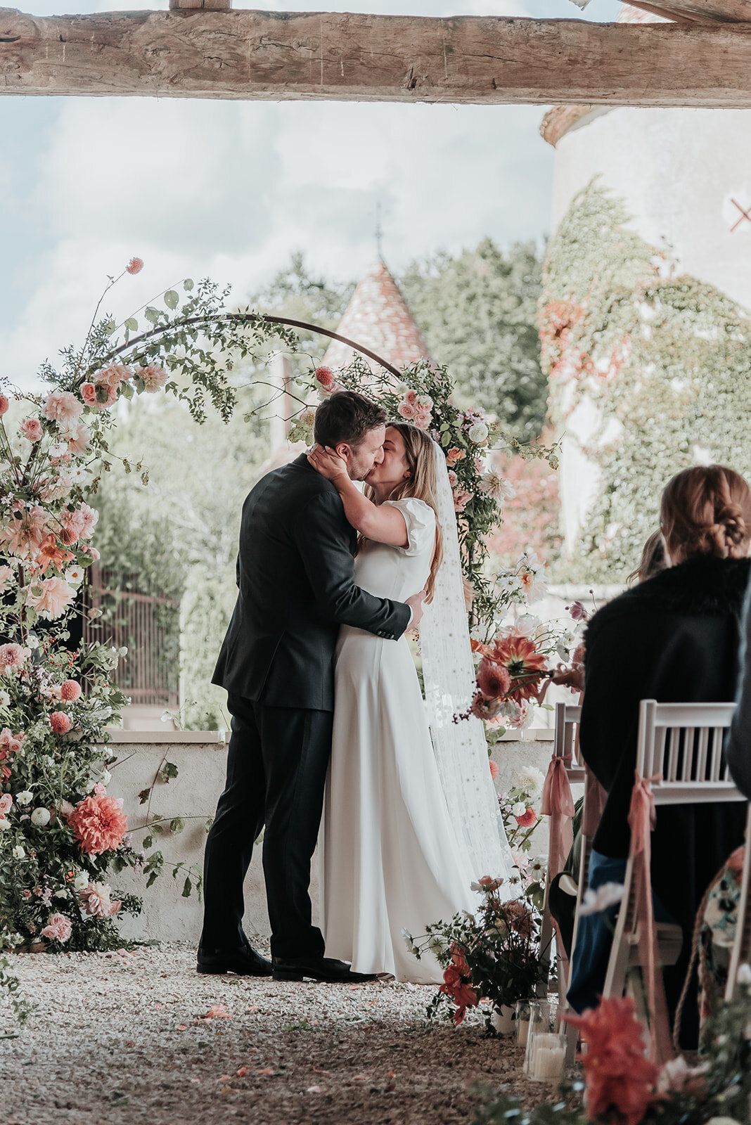 Bride and Groom share a kiss as they get married in France
