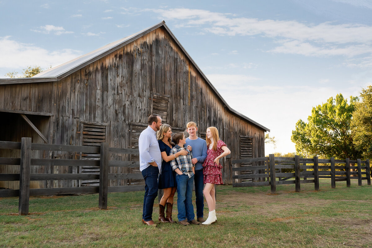A family photography session at a local barn that is rustic and beautiful.