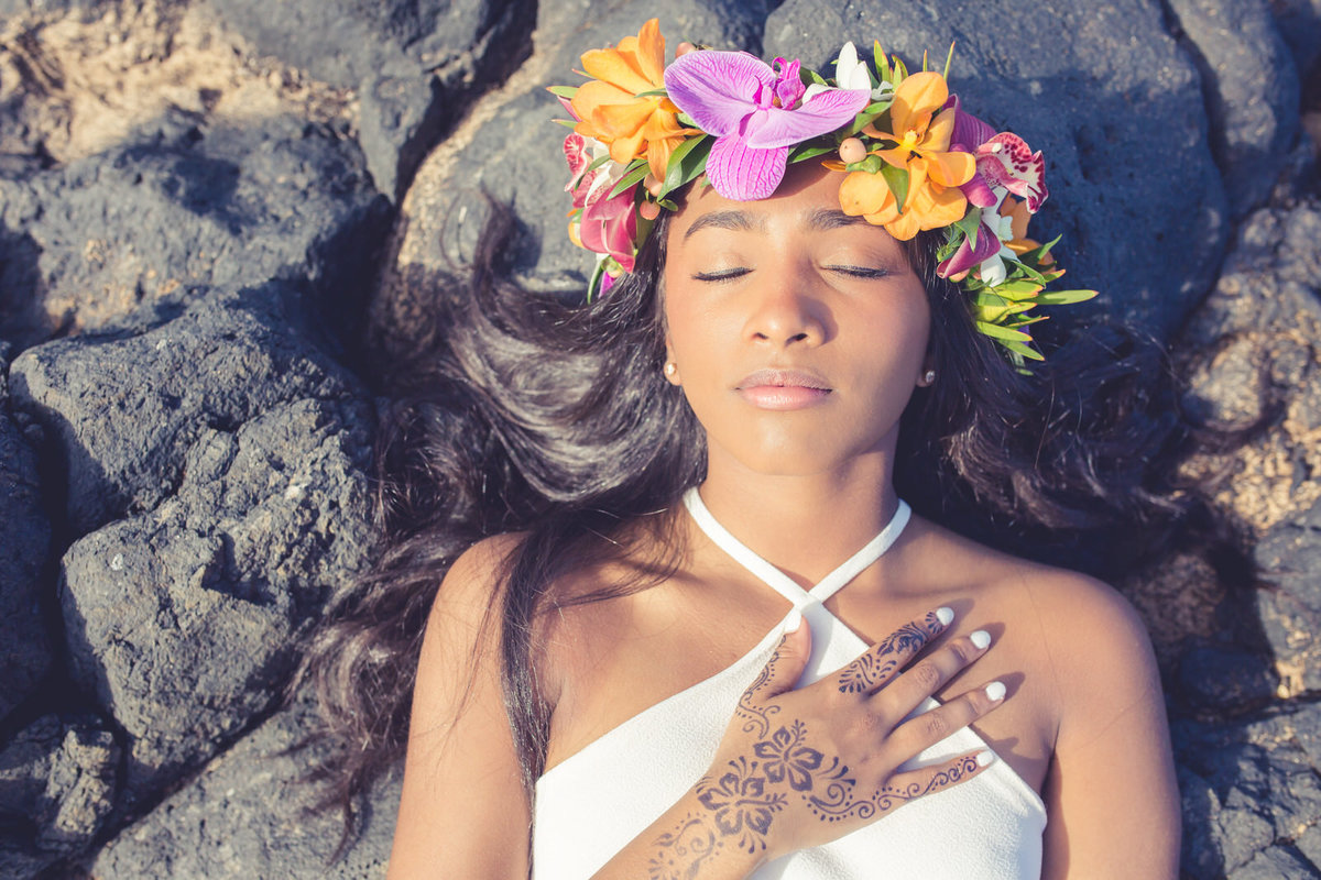Maui senior portrait of girl with flower crown in lava rocks