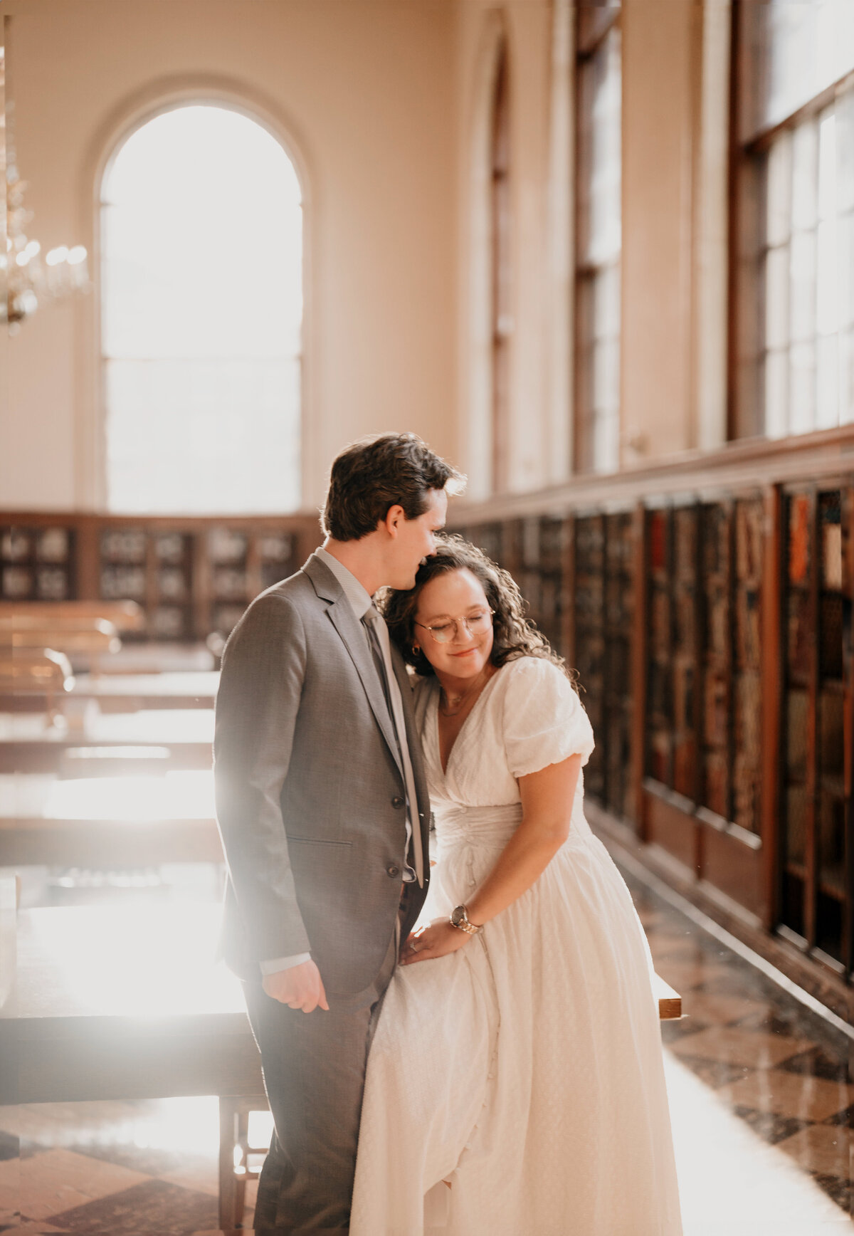 A engaged couple hugging at UNC.