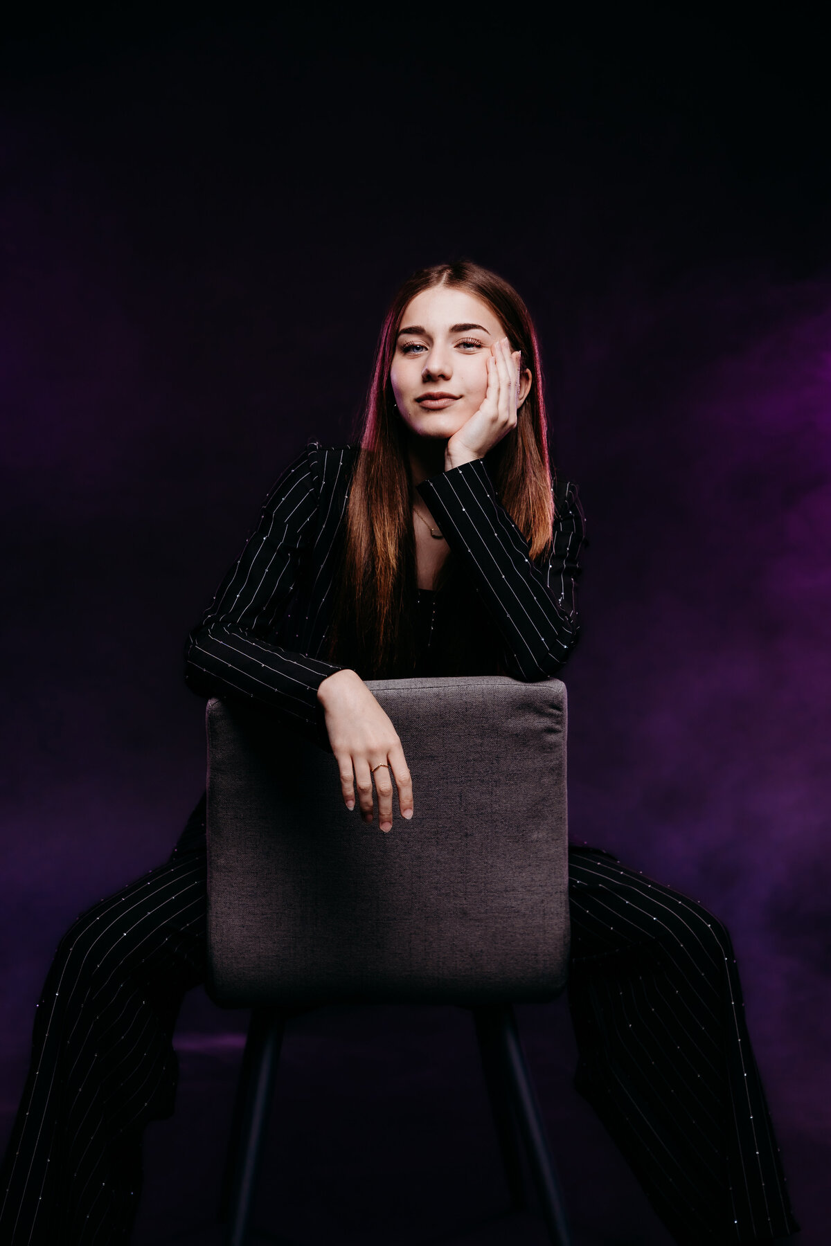 Ionia teen girl sitting backwards in a chair. 