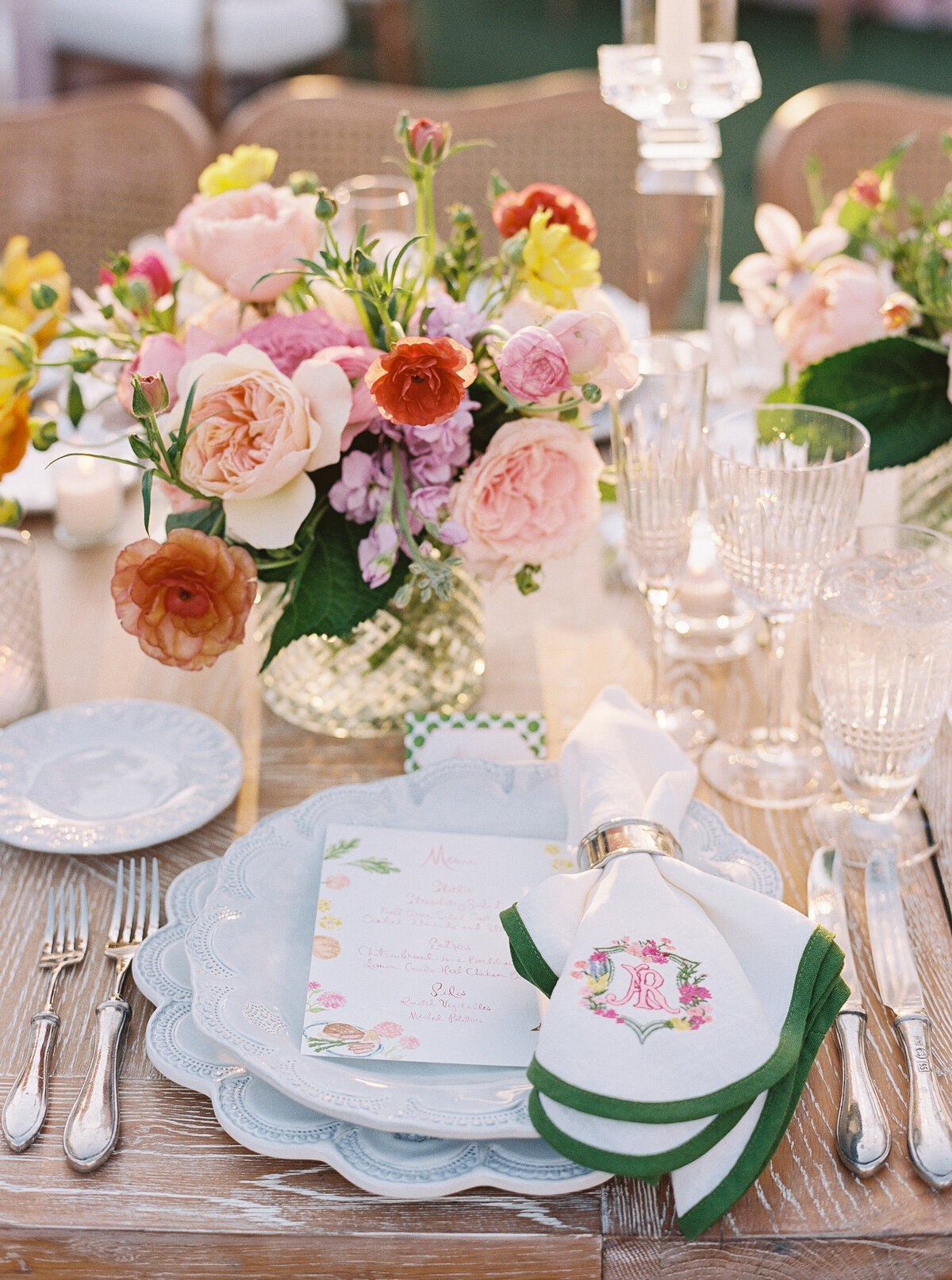 A fine art wedding reception table setting with fresh florals, crystal glassware, and custom menus, photographed at an upscale Arizona wedding.