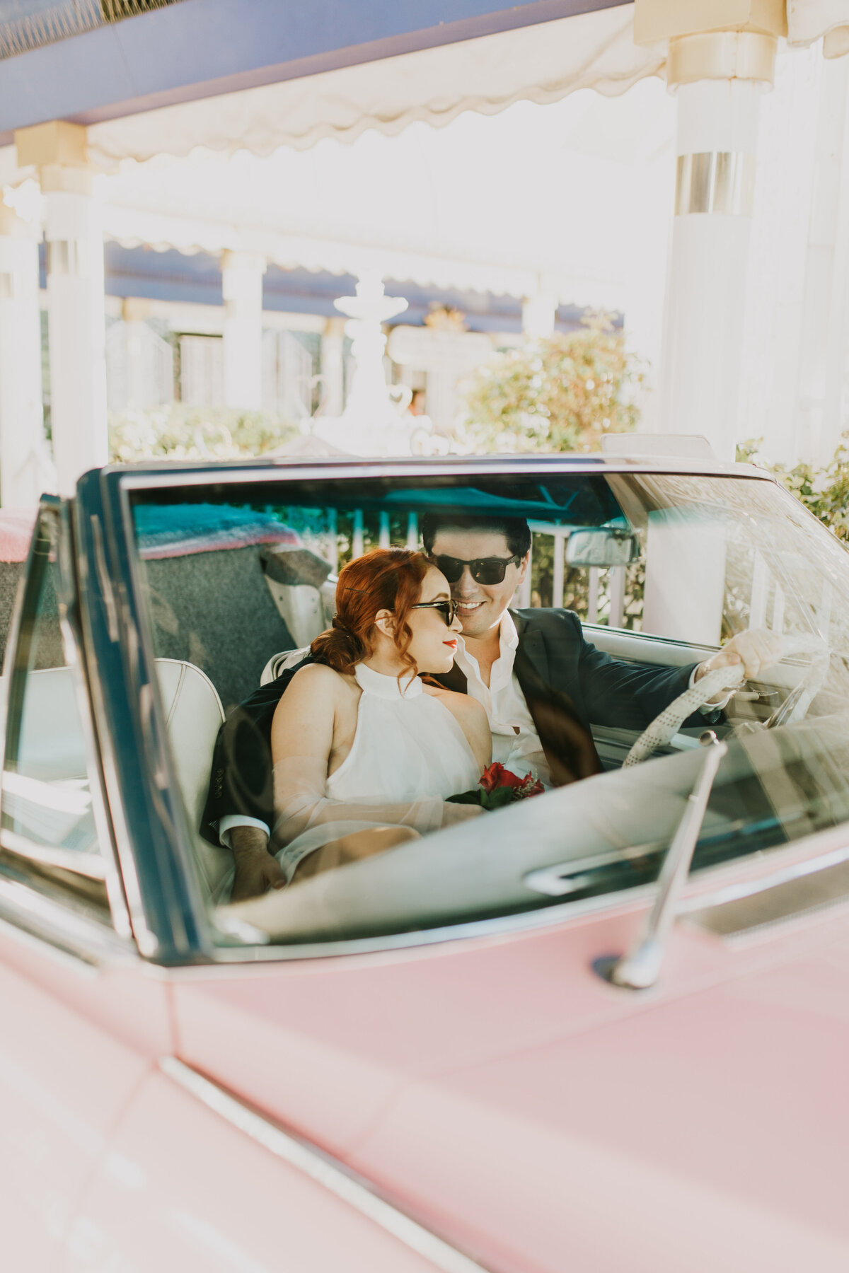 bride and groom in car during wedding