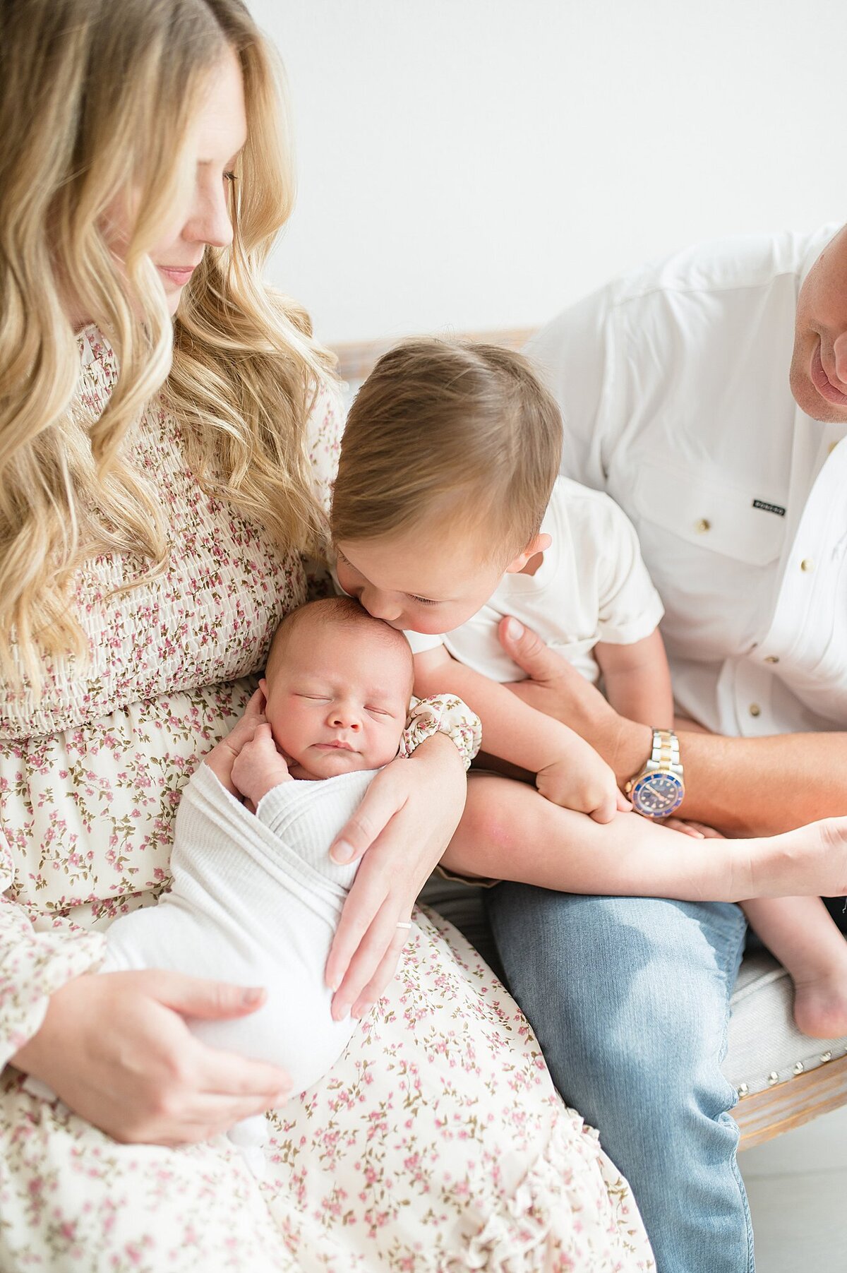 family holding baby in Frisco Newborn Photography session