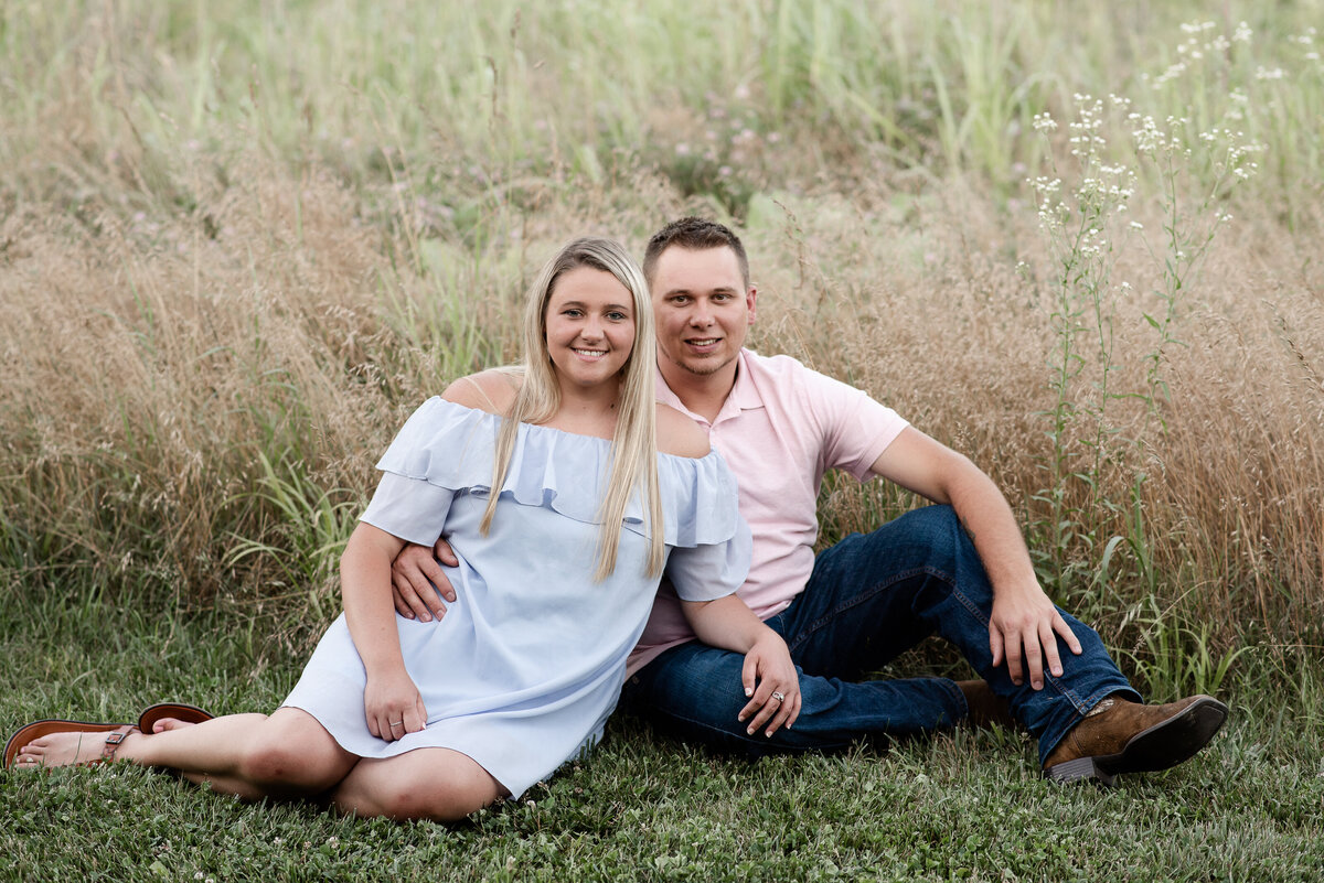Engagement session with a sitting pose for couple taken by Michelle Lynn Photography located near Louisville, Kentucky