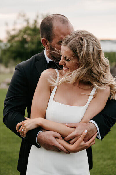 Bride and groom embracing planned by chicago wedding planners