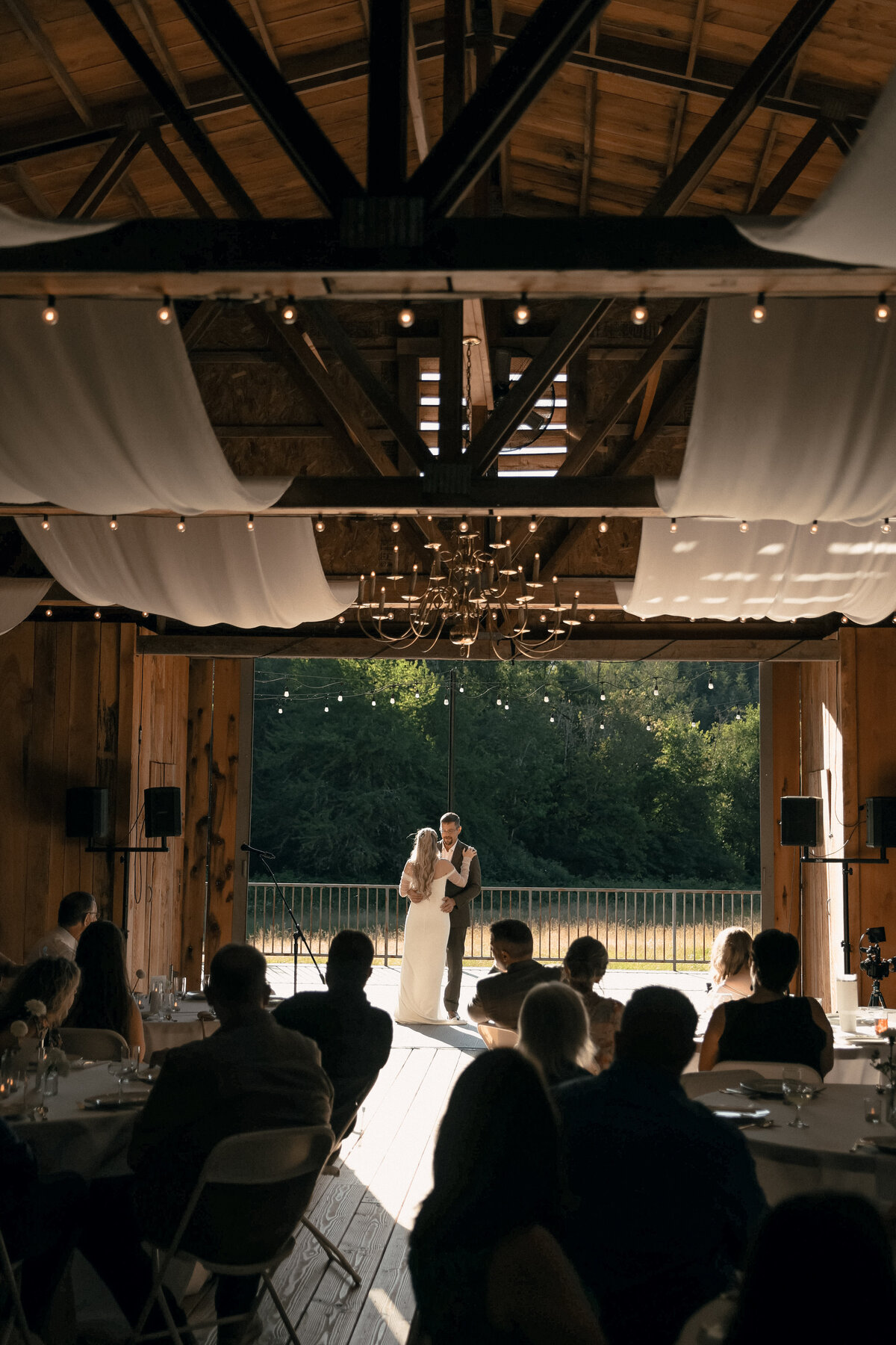 First Dance Under String Lights in Rustic Barn | Intimate Oregon Wedding Photographer
