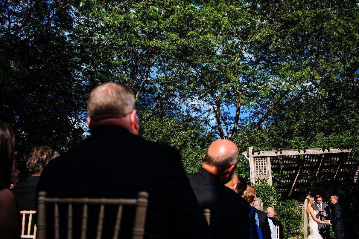 A guest moves to see a wedding ceremony at a Galleria Marchetti wedding.