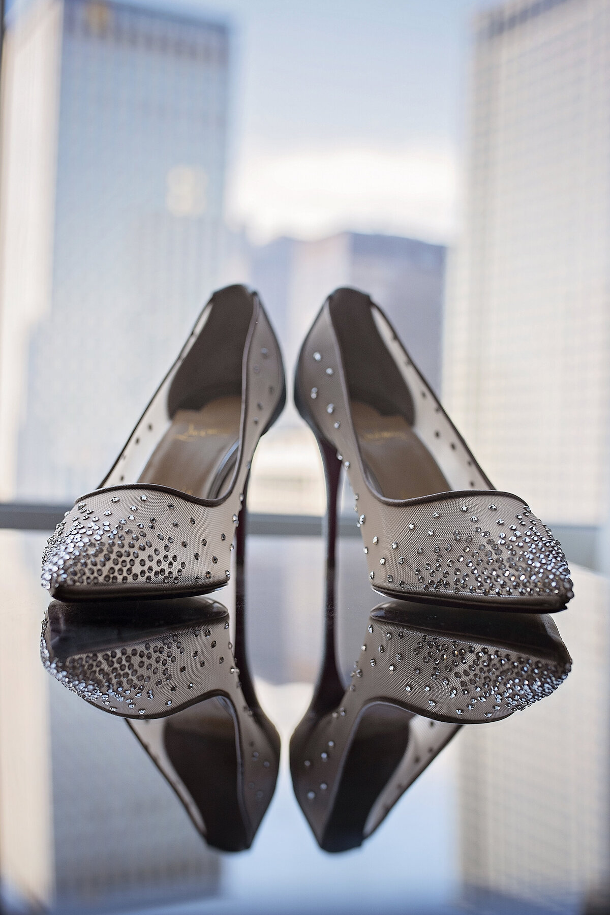 Christian Louboutin sparkle red bottom heels reflecting on the mirror