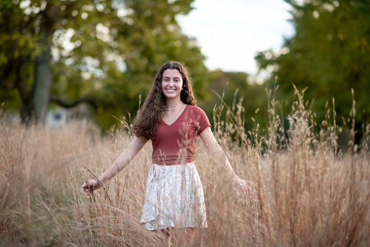 senior girl in dried grass field