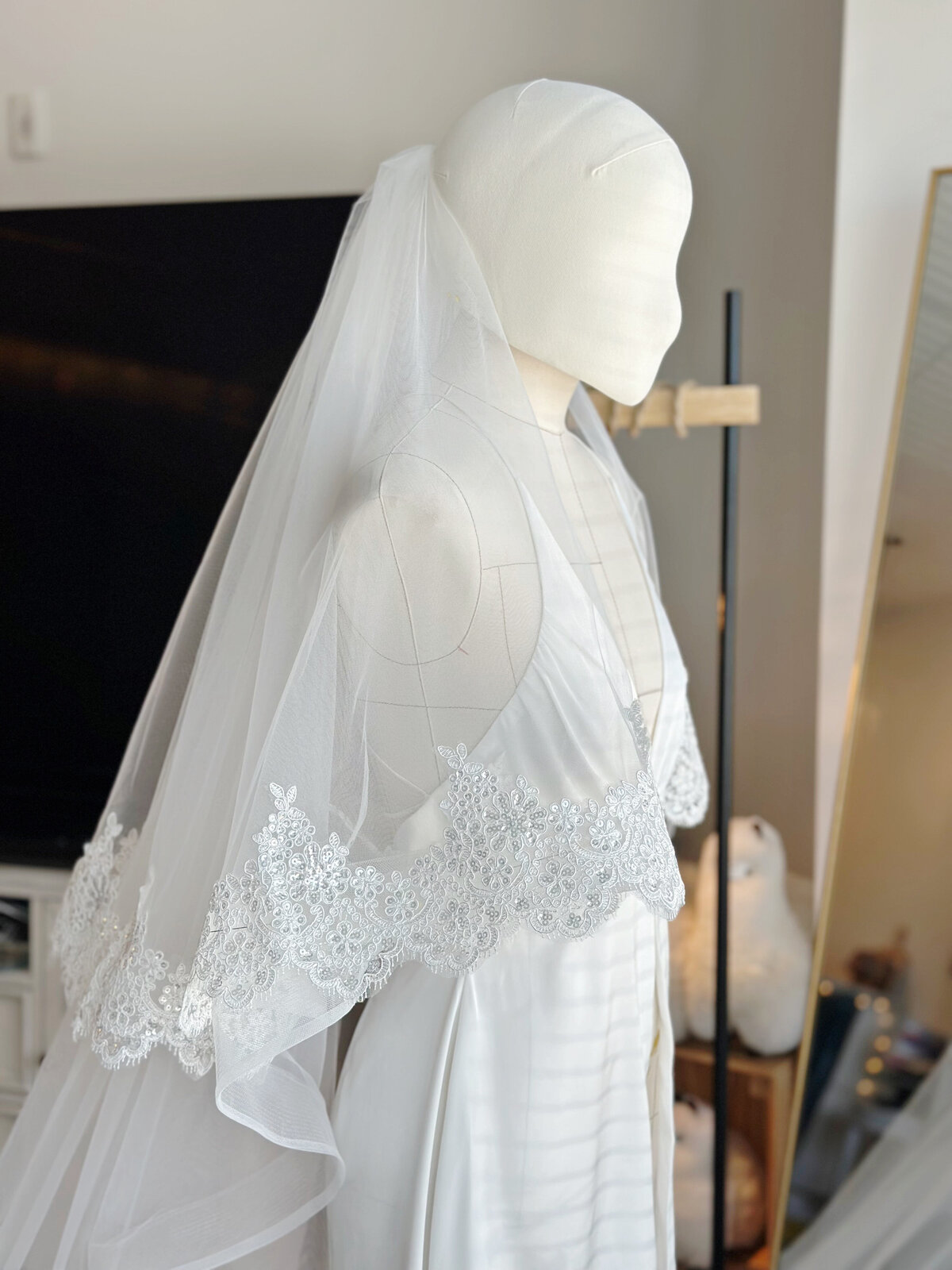 Bride wearing handmade lace blusher veil with comb
