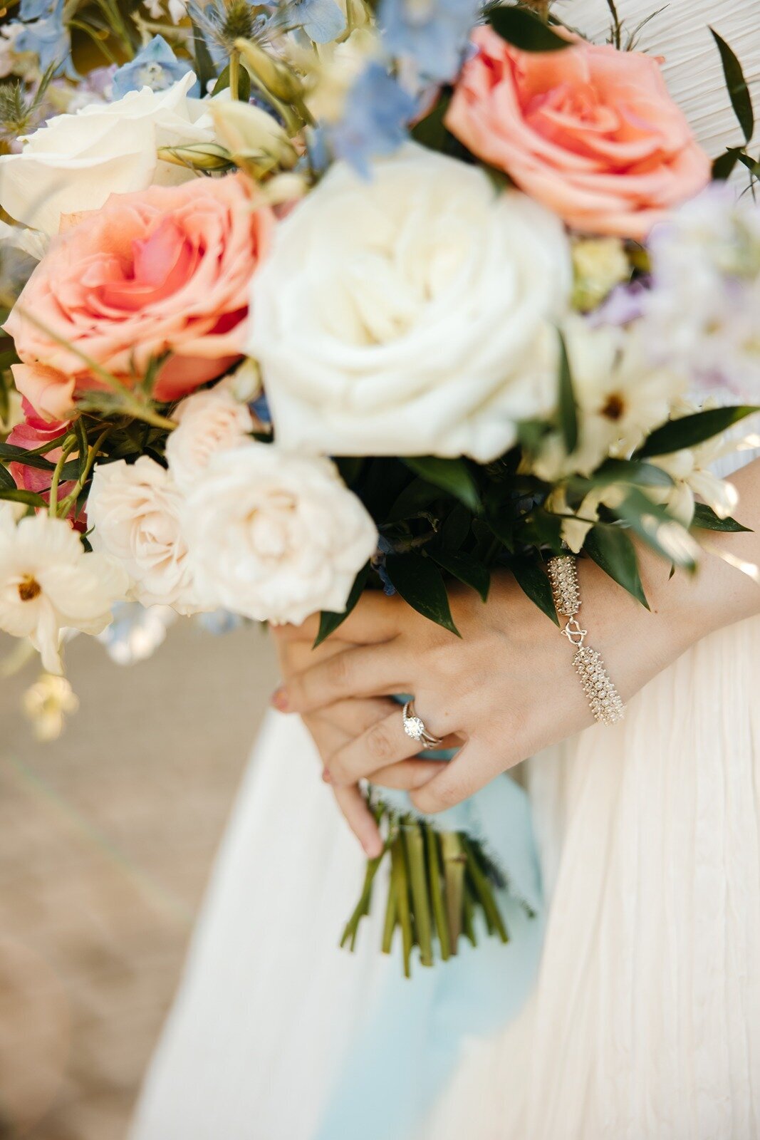 Bride holding her pink and white bouquet