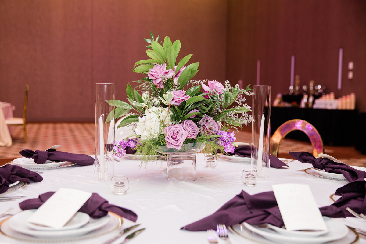purple flower arrangement in the center of a table