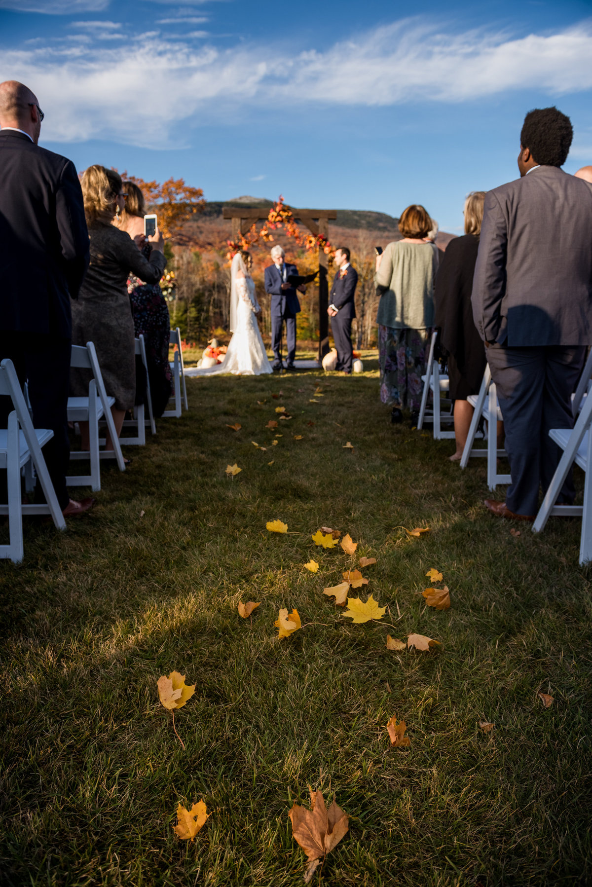leaves on the ground during fall wedding in outdoor venue NH