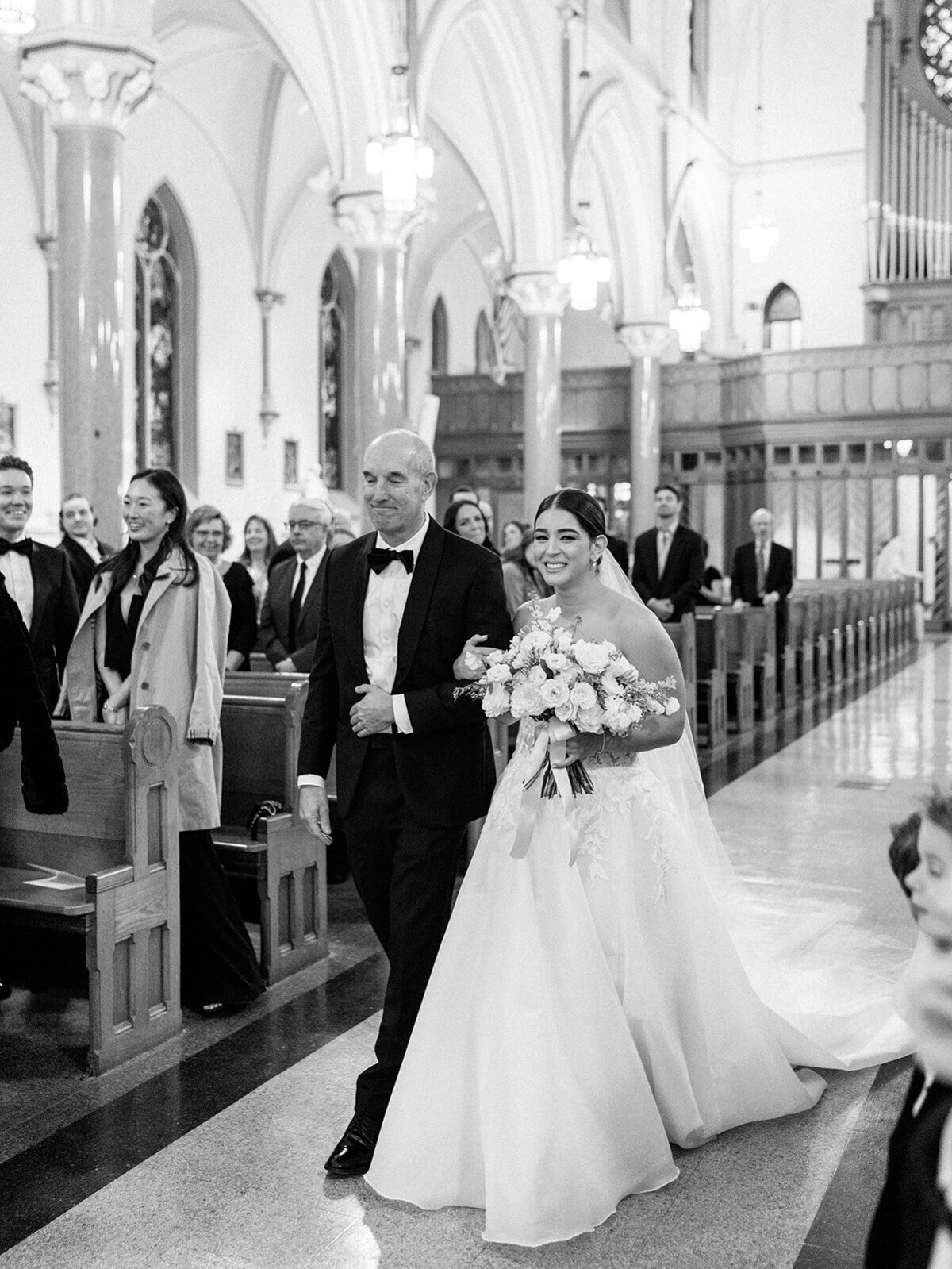 Father and Bride near the end of the prcession down the aisle