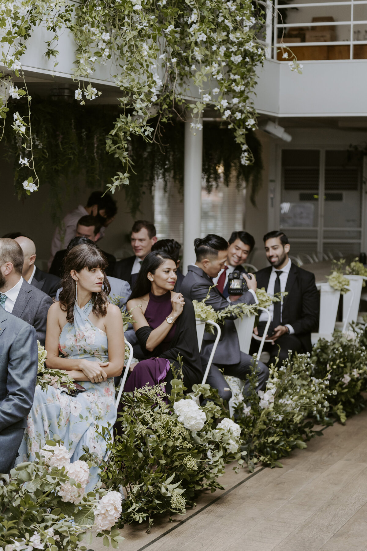 the guests smiling and sitting at their seats