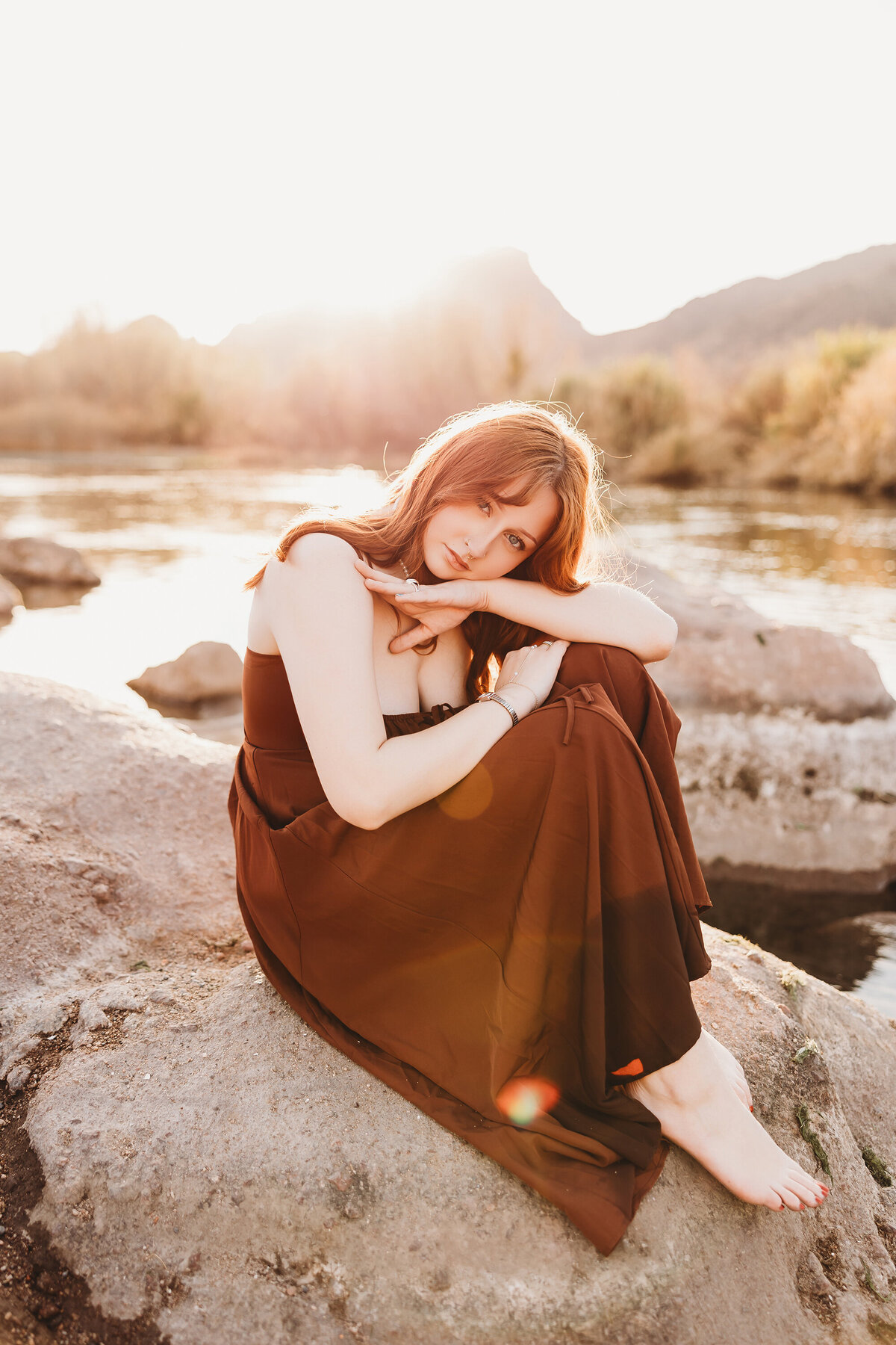 Girl with red hair posing at salt river for senior session by phoenix photographer